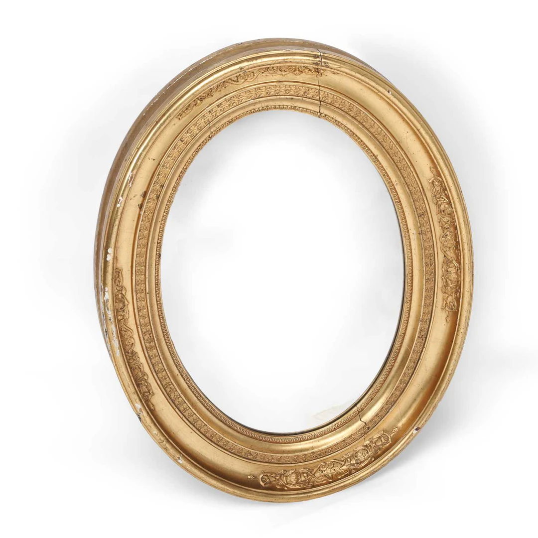 AN OVAL GILTWOOD WALL MIRROR