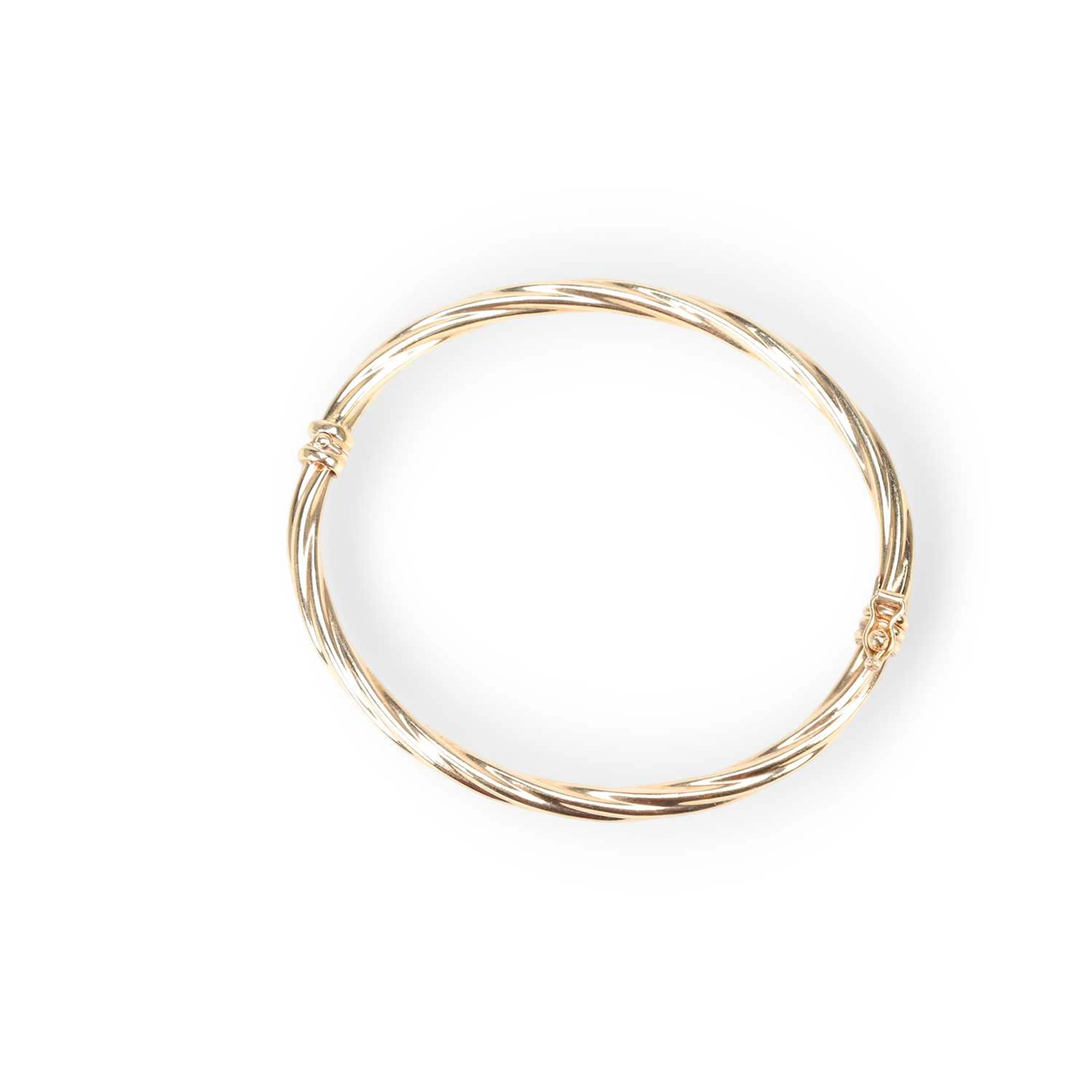 A HINGE OPENING BANGLE