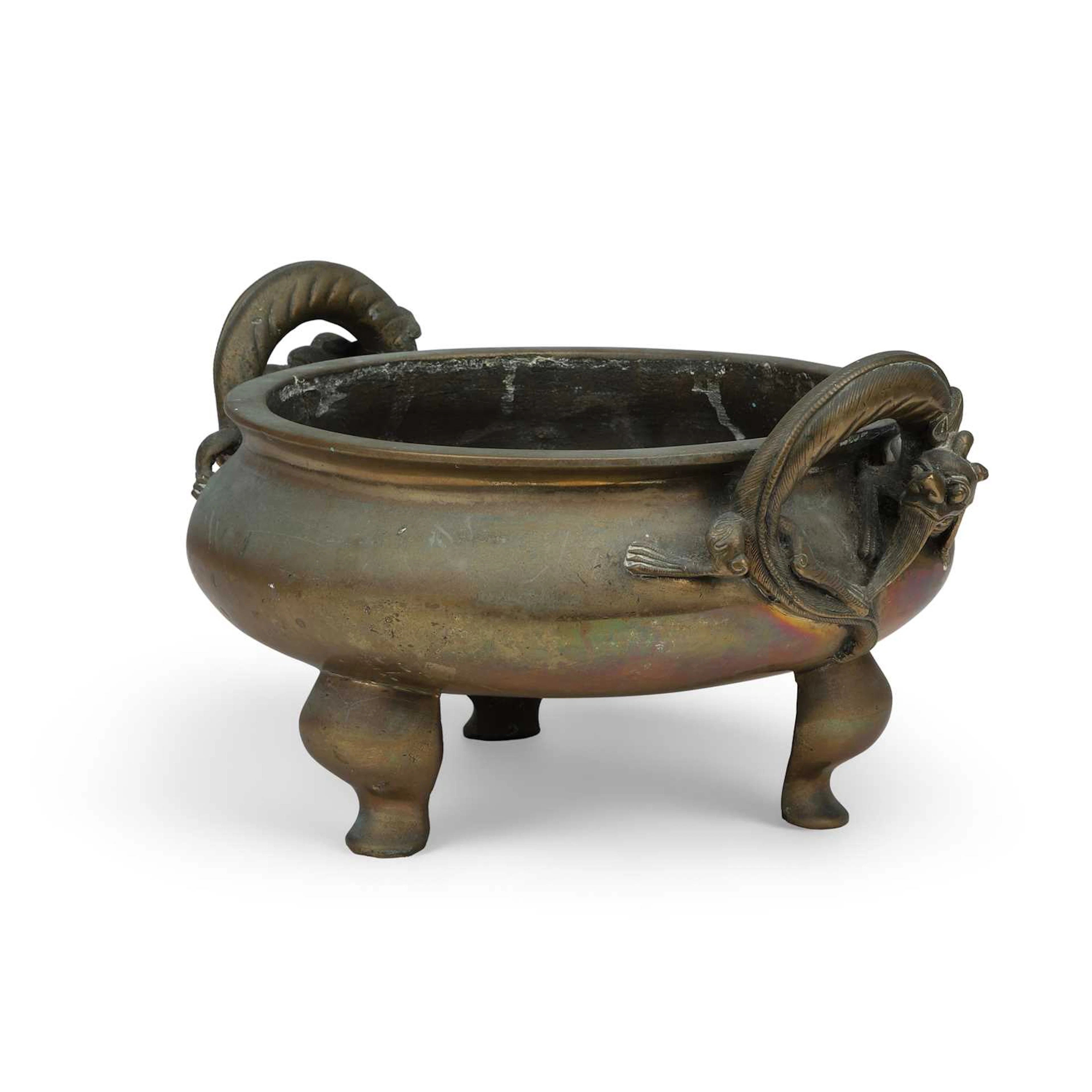 A CHINESE BRONZE TRIPOD CENSER