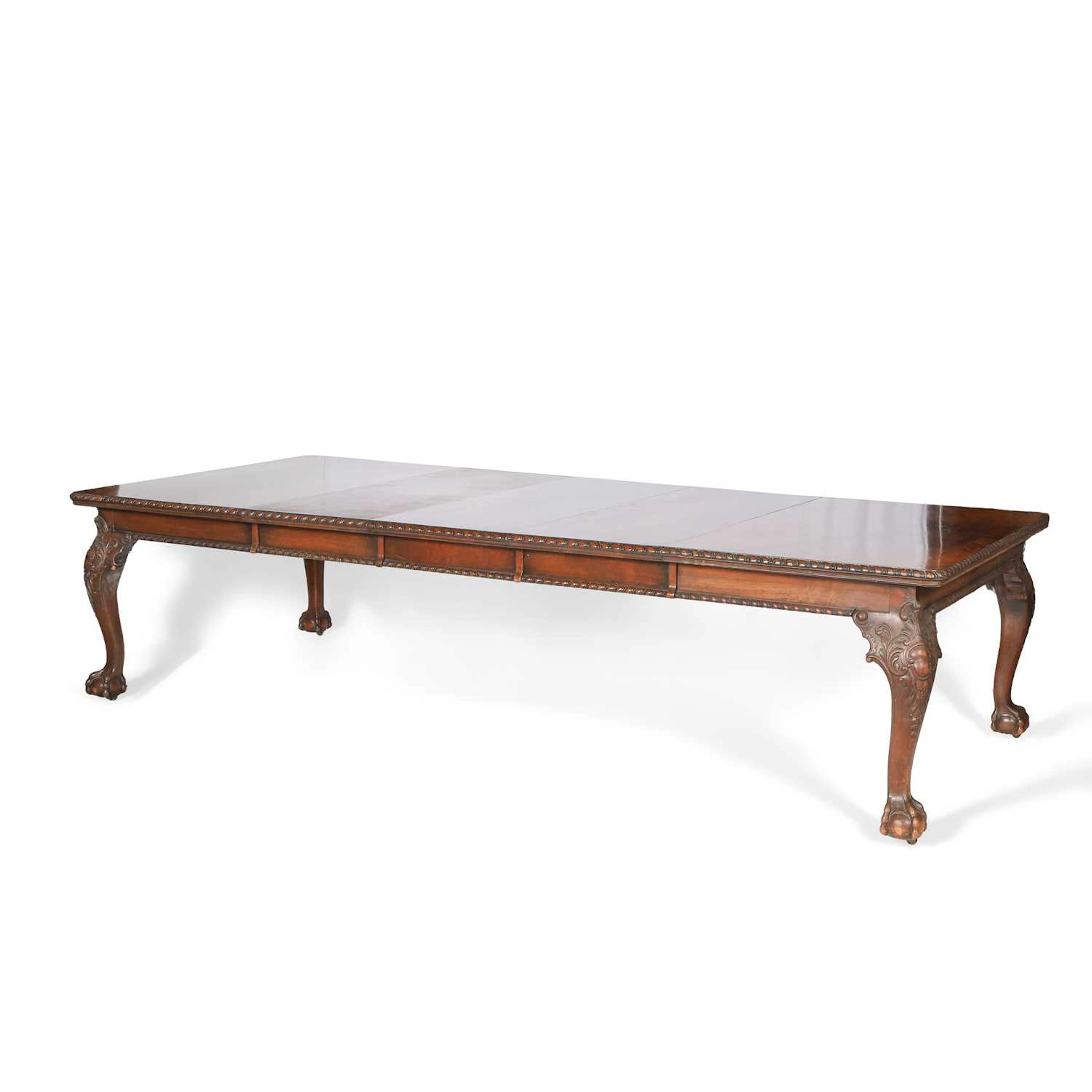 A GEORGE II STYLE WALNUT EXTENDING DINING TABLE