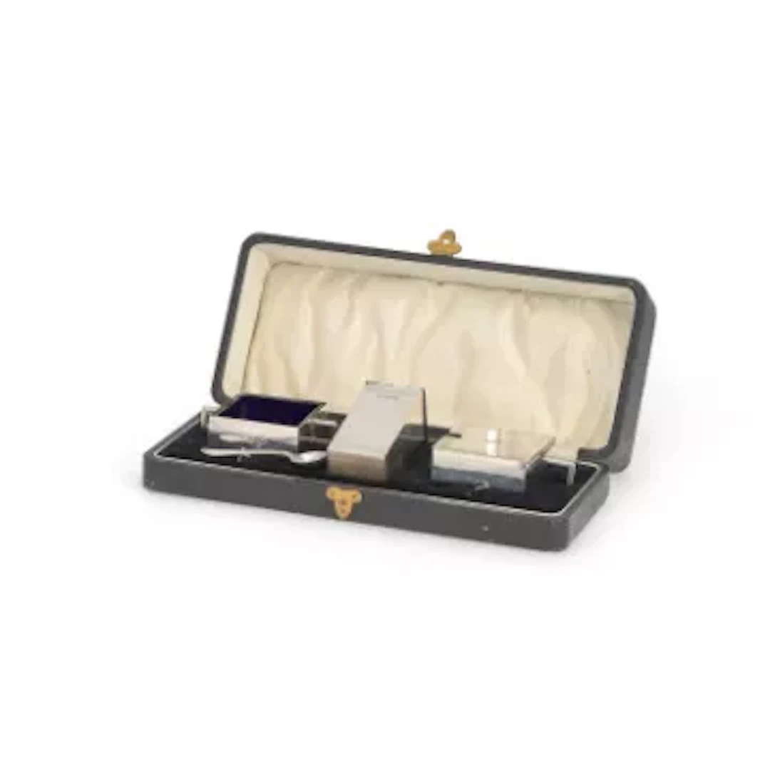 AN ART DECO SILVER THREE-PIECE CONDIMENT SET