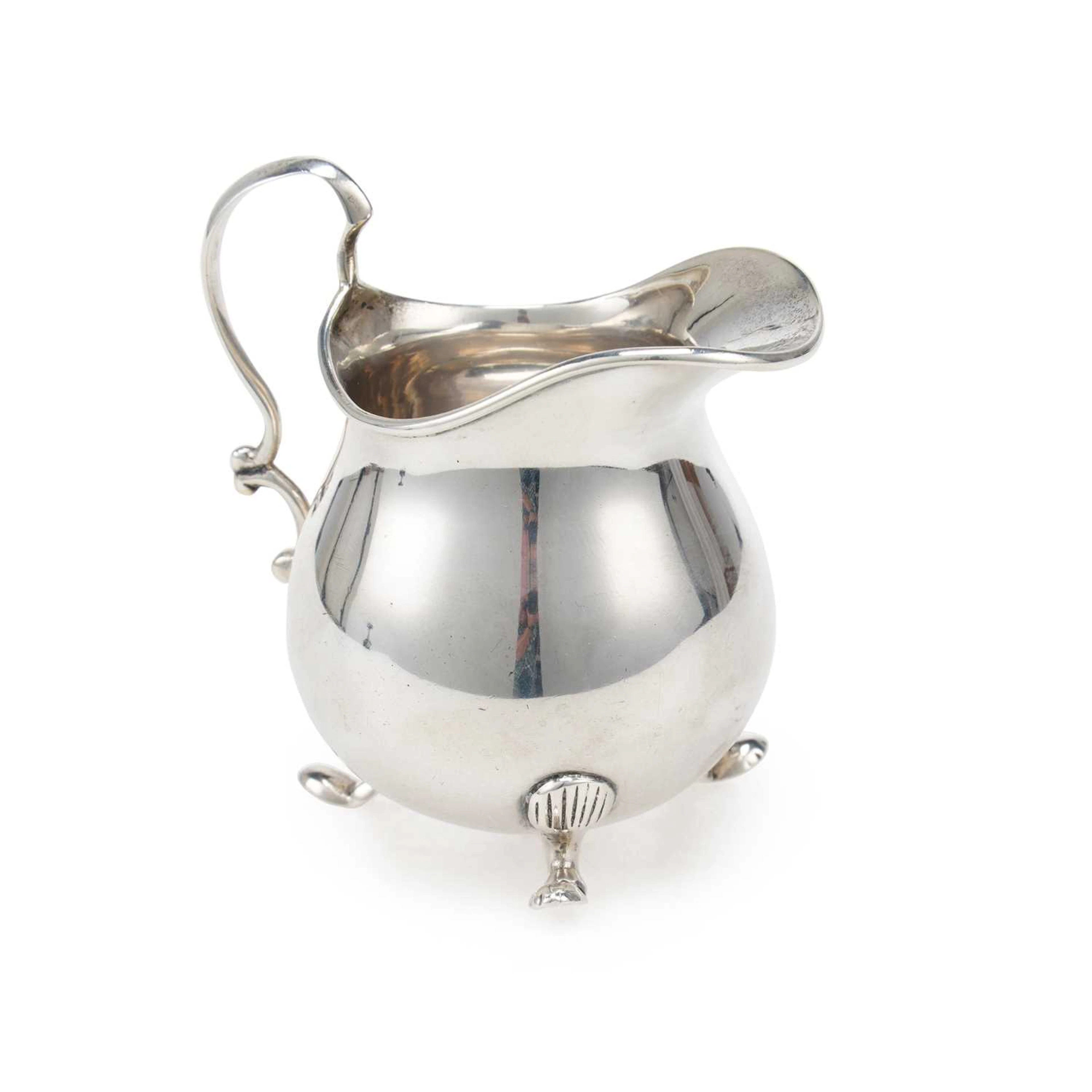 A GEORGE V SILVER CREAM JUG