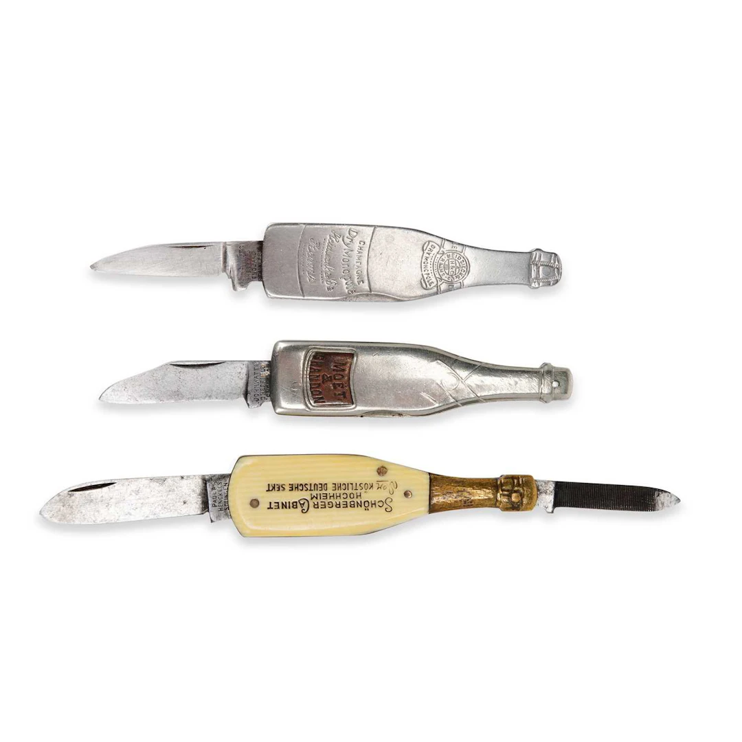 THREE NOVELTY WINE BOTTLE PEN KNIVES EARLY 20TH CENTURY