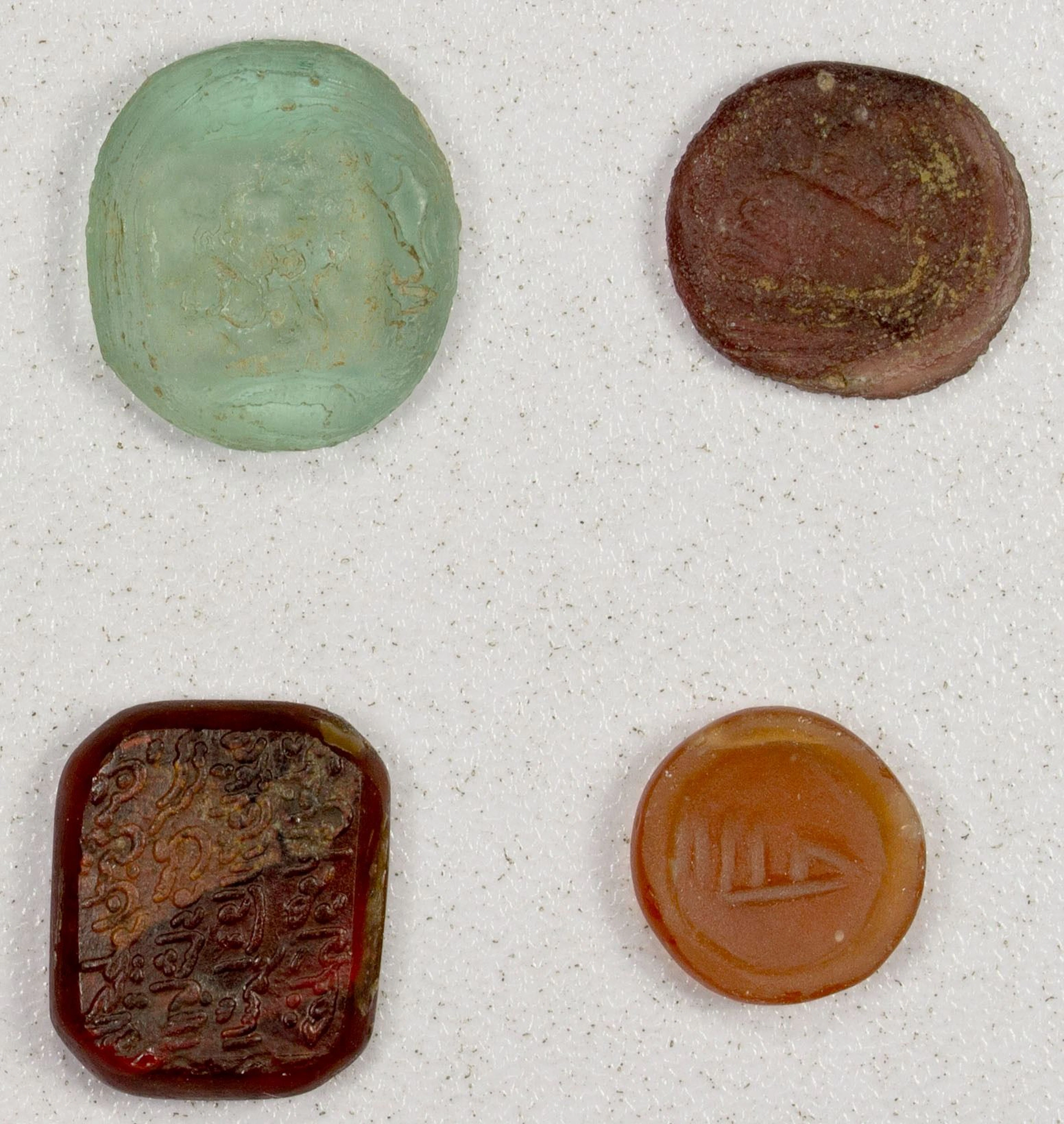 MEDIEVAL ISLAMIC: LOT of 3 glass weights and 1 glass stamp
