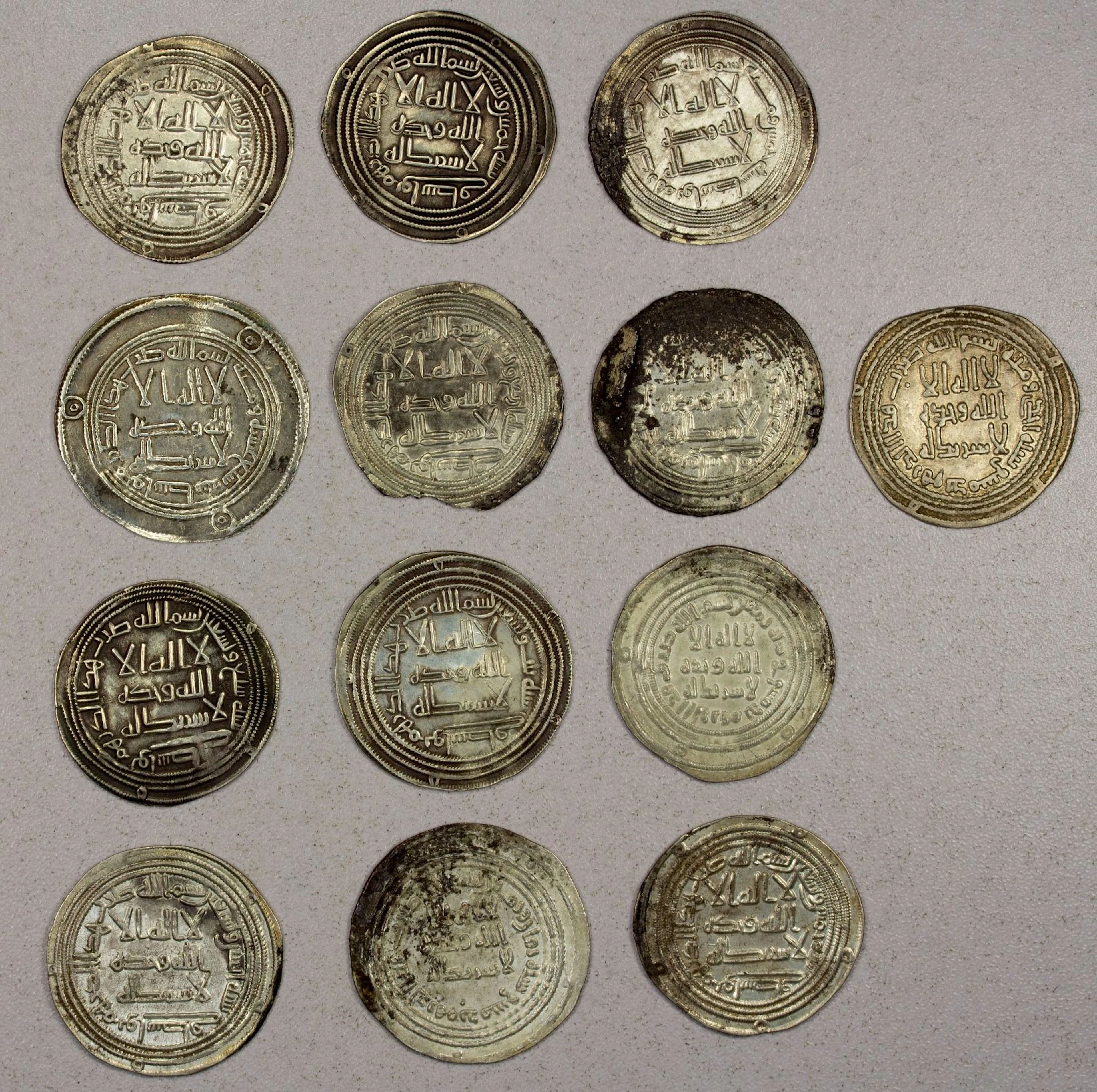 EARLY ISLAMIC: UMAYYAD: LOT of 13 silver dirhams