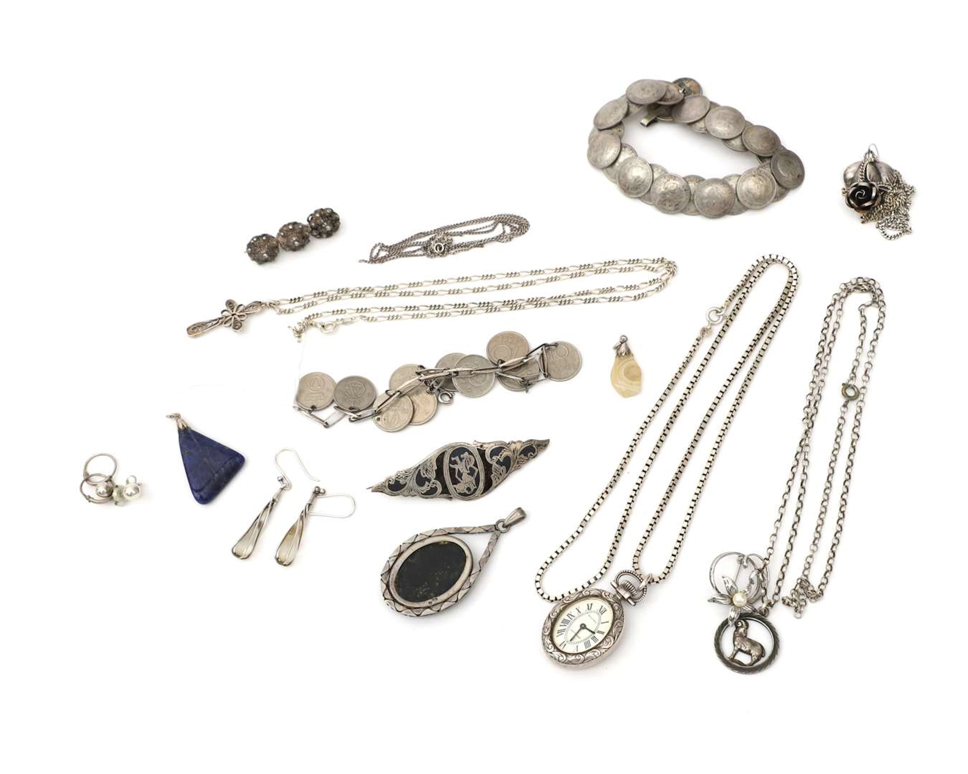 A lot of silver jewellery, including two coin bracelets