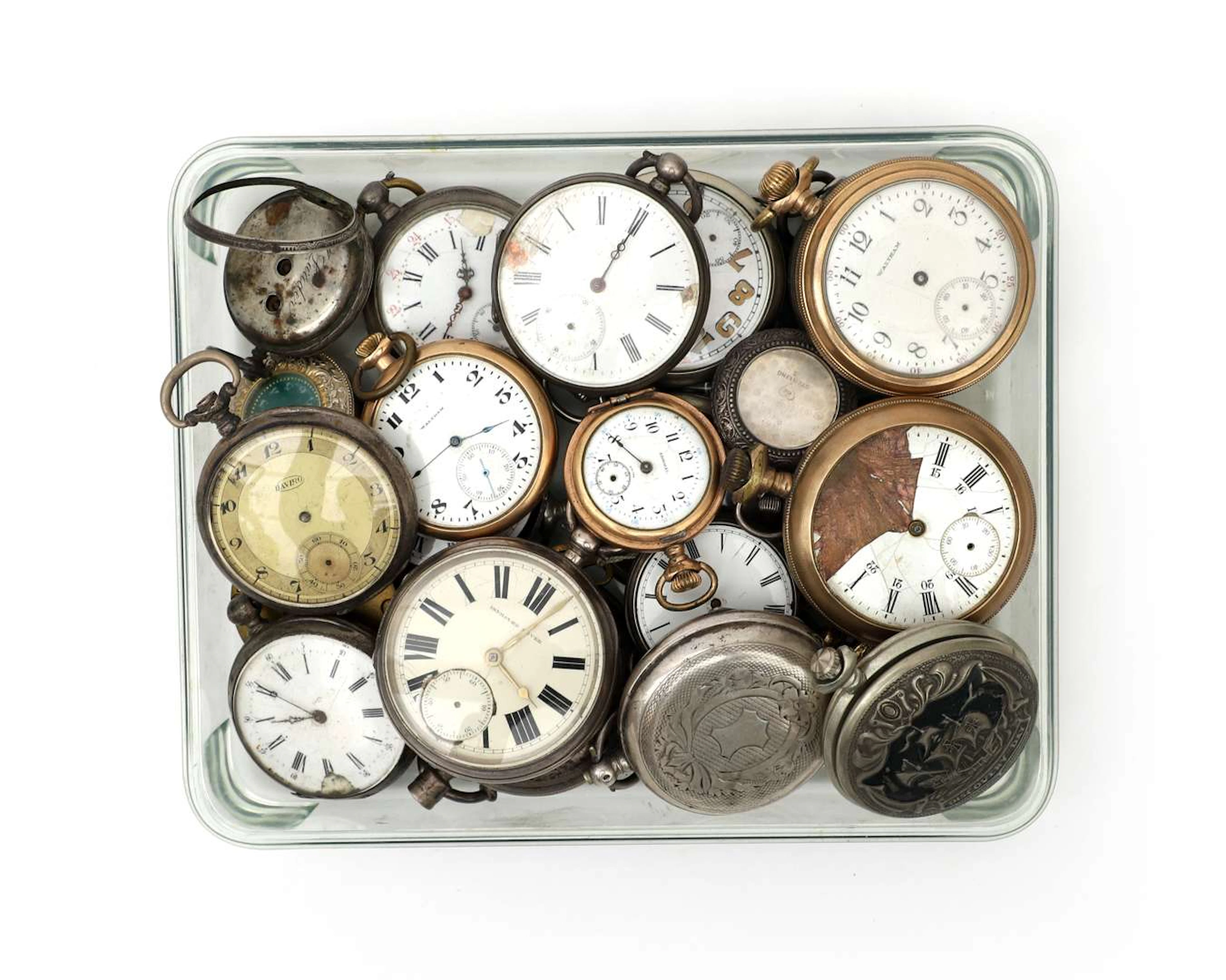 Various broken pocket watches, including one with a silver case
