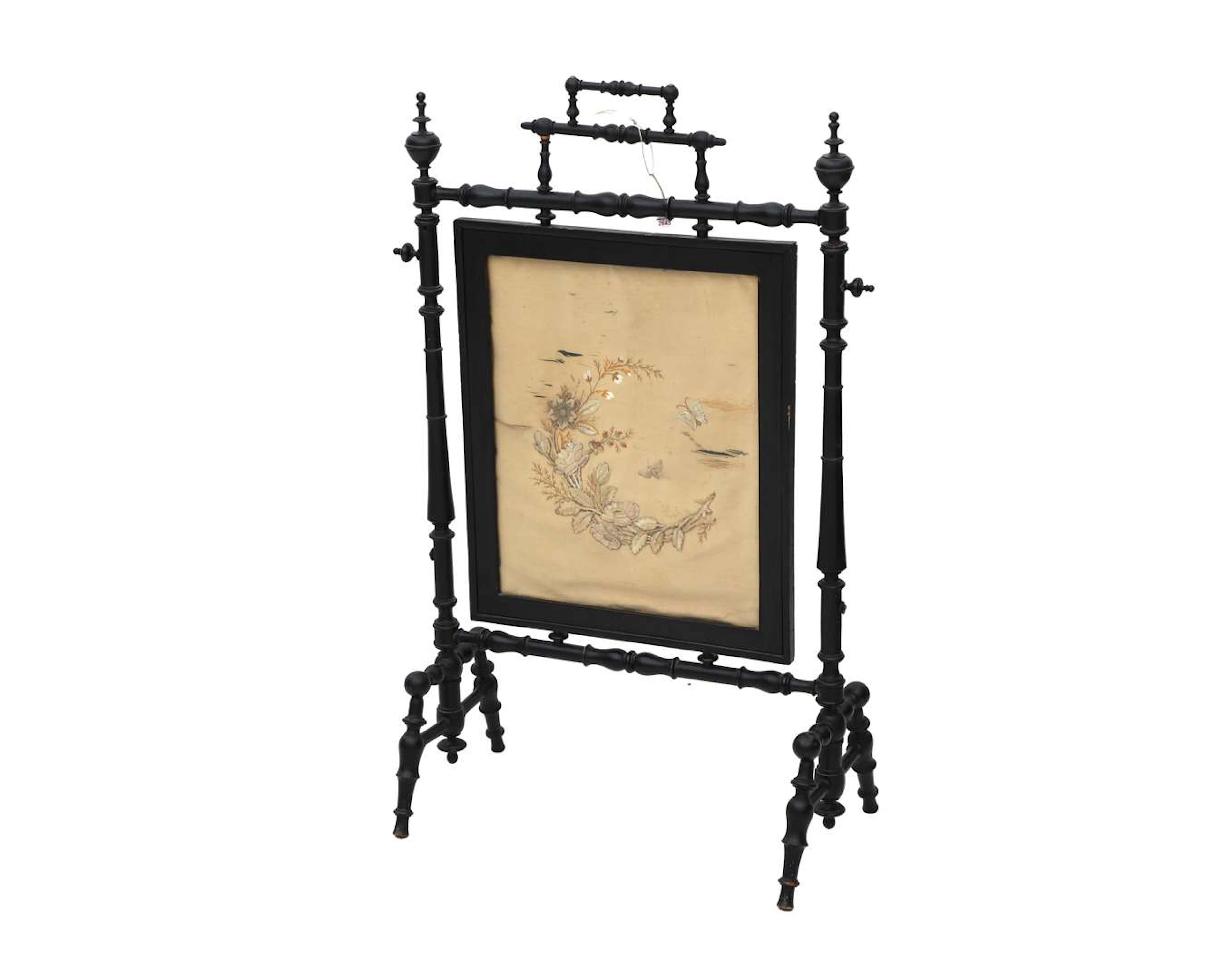 A blackened wooden folding screen with oriental embroidery. Circa 1900