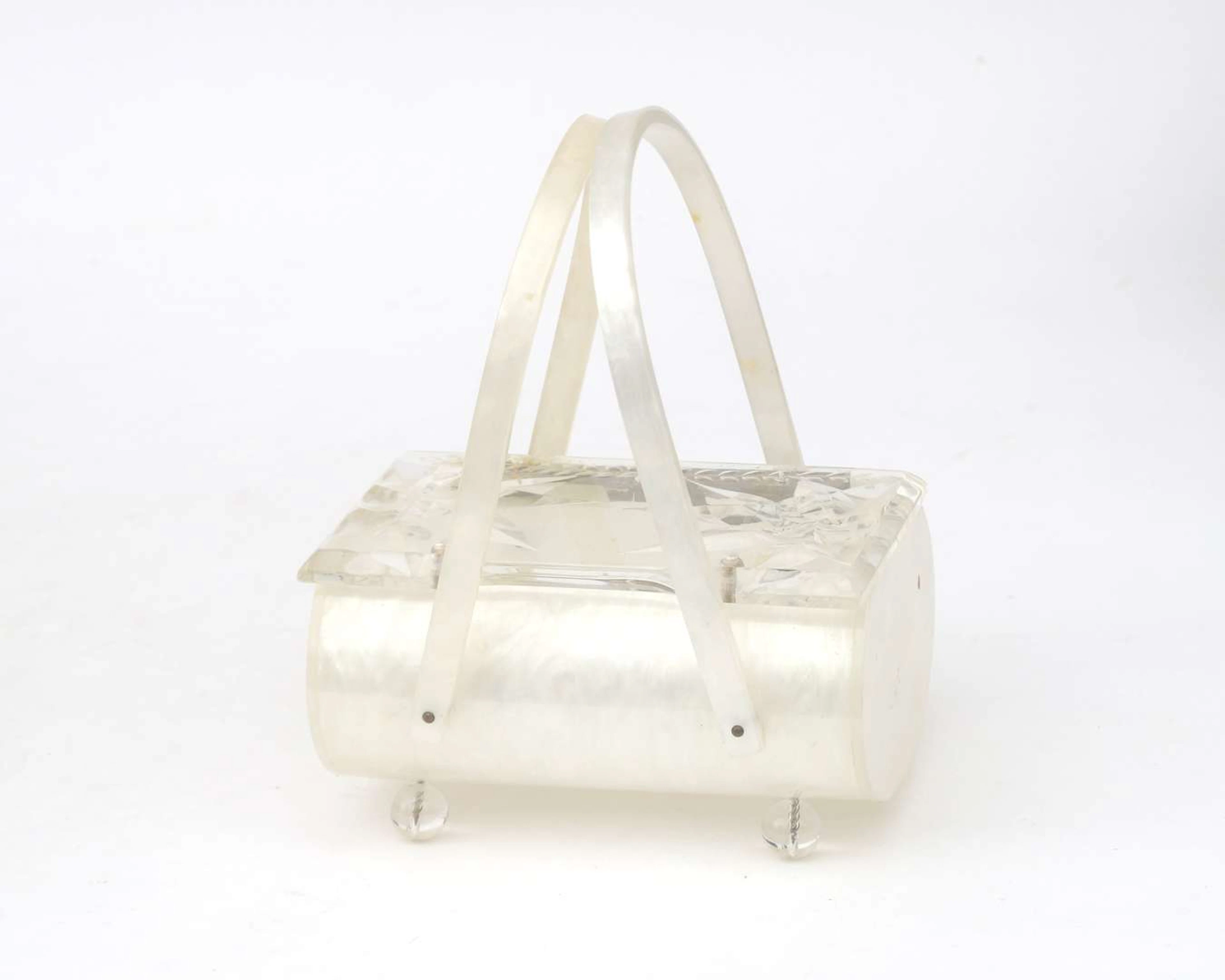 A mother-of-pearl lucite handbag/clutch, 1950s