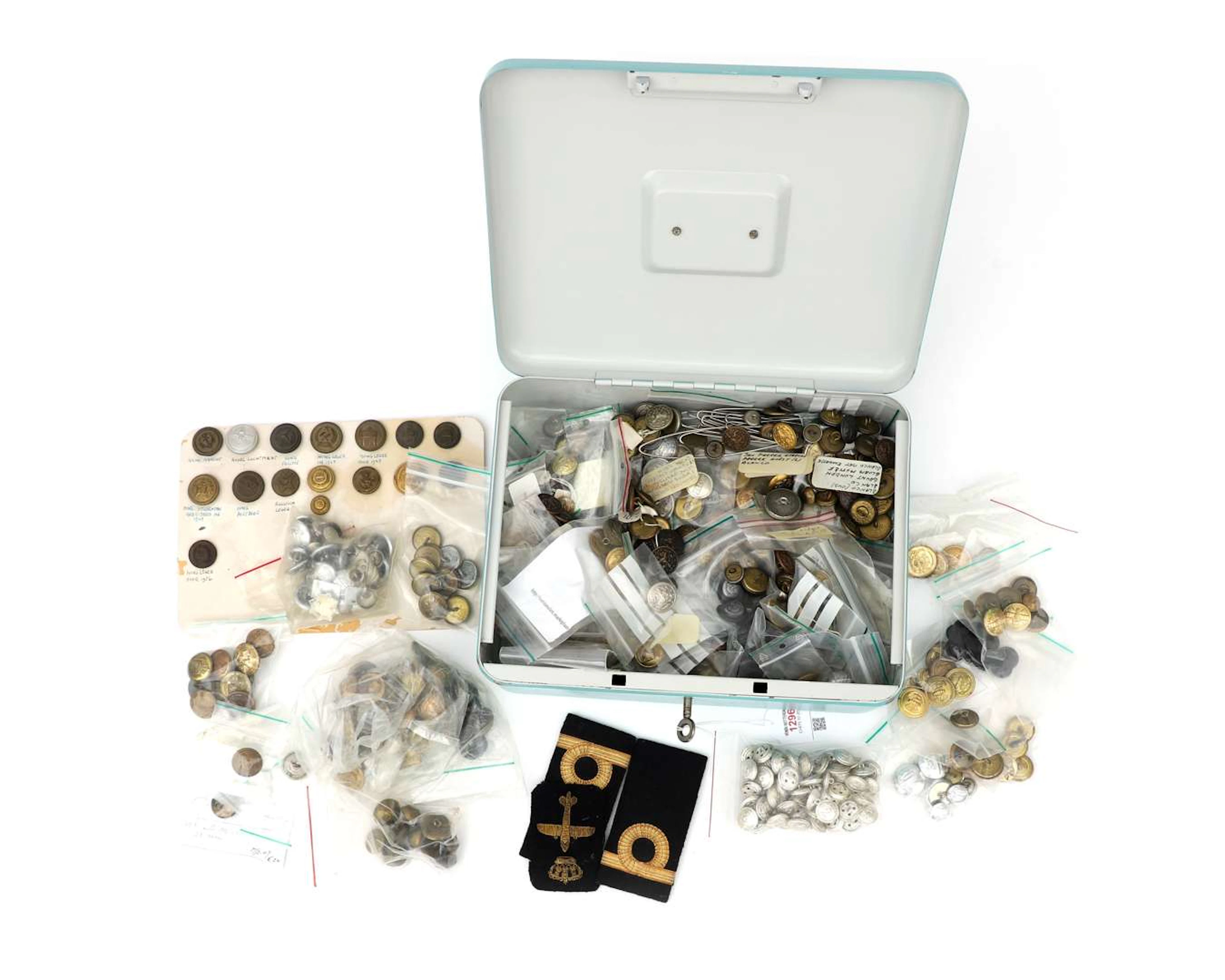 A collection of various uniform buttons, including some from Hong