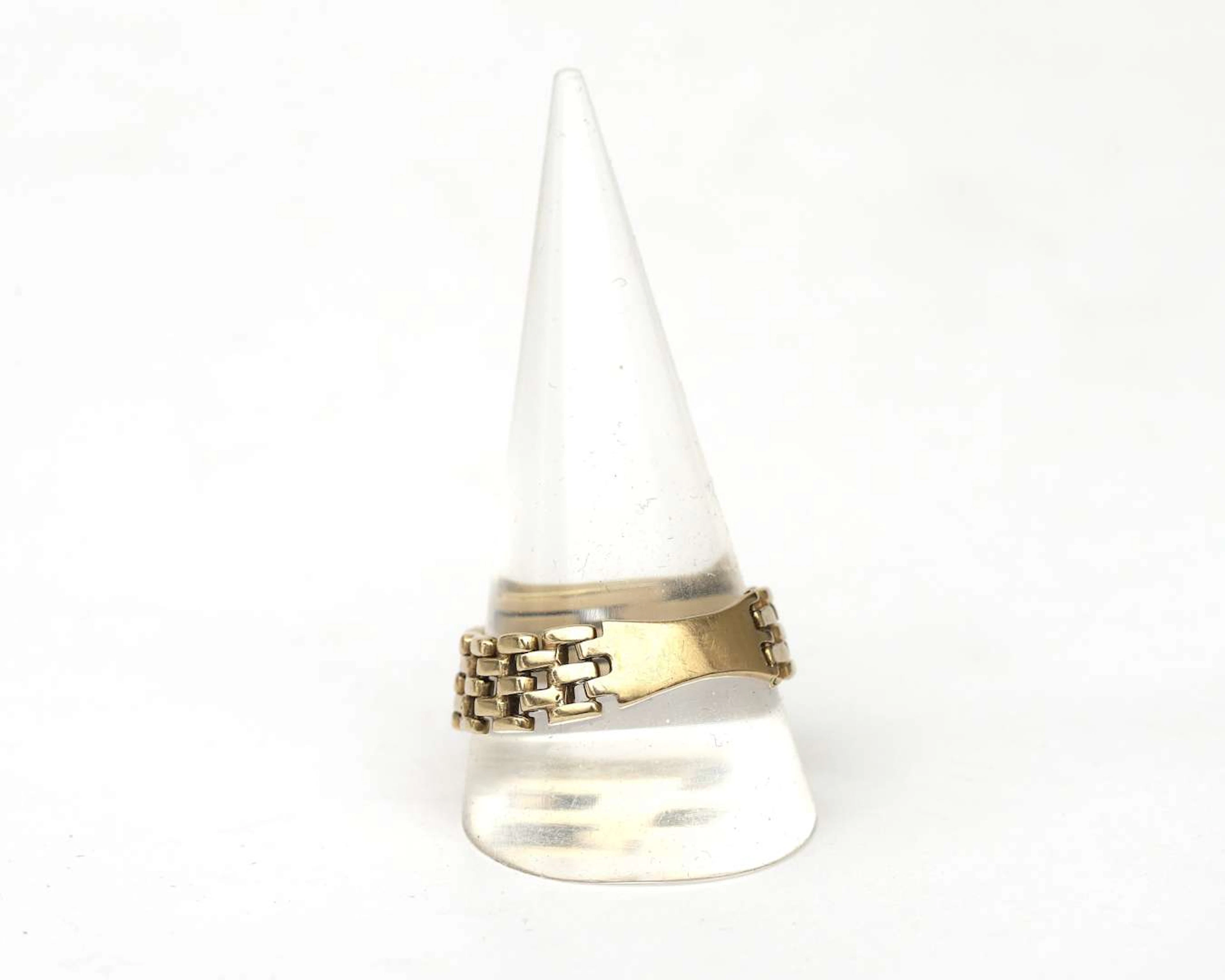A 14 crt. yellow gold rolex link ring