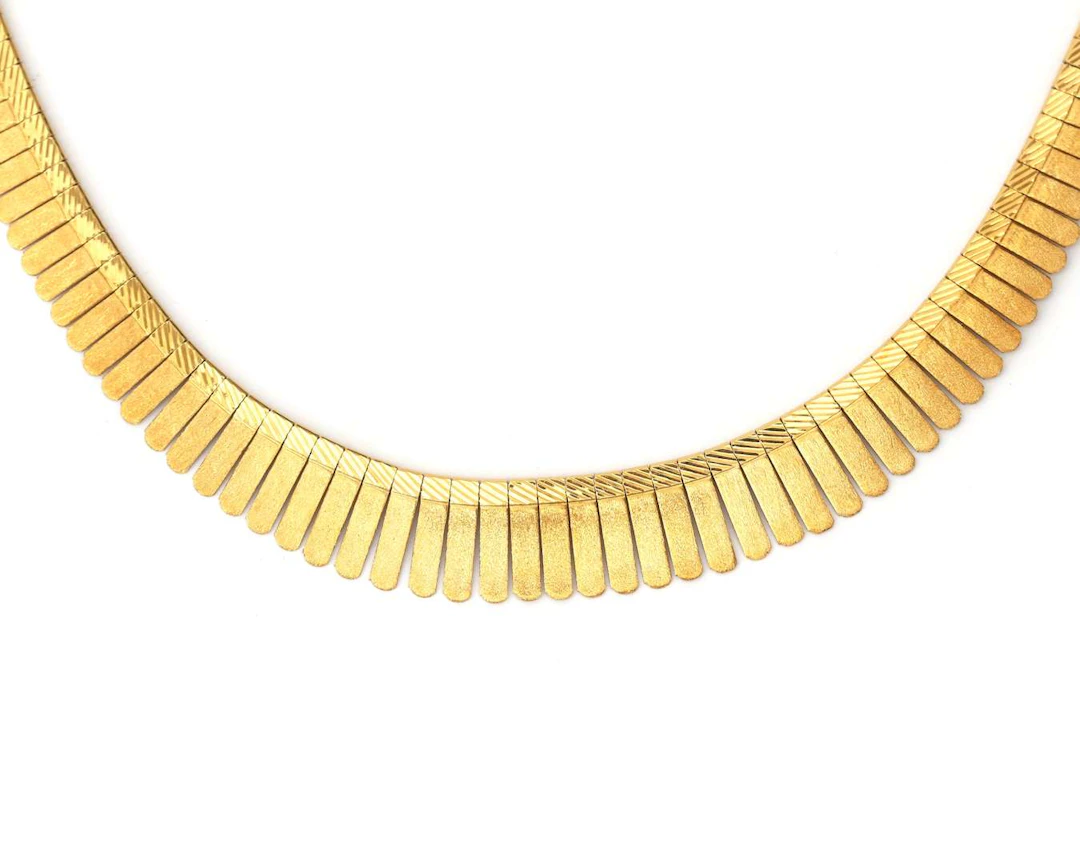 An 18k yellow gold Cleopatra necklace, 1960s–1970s