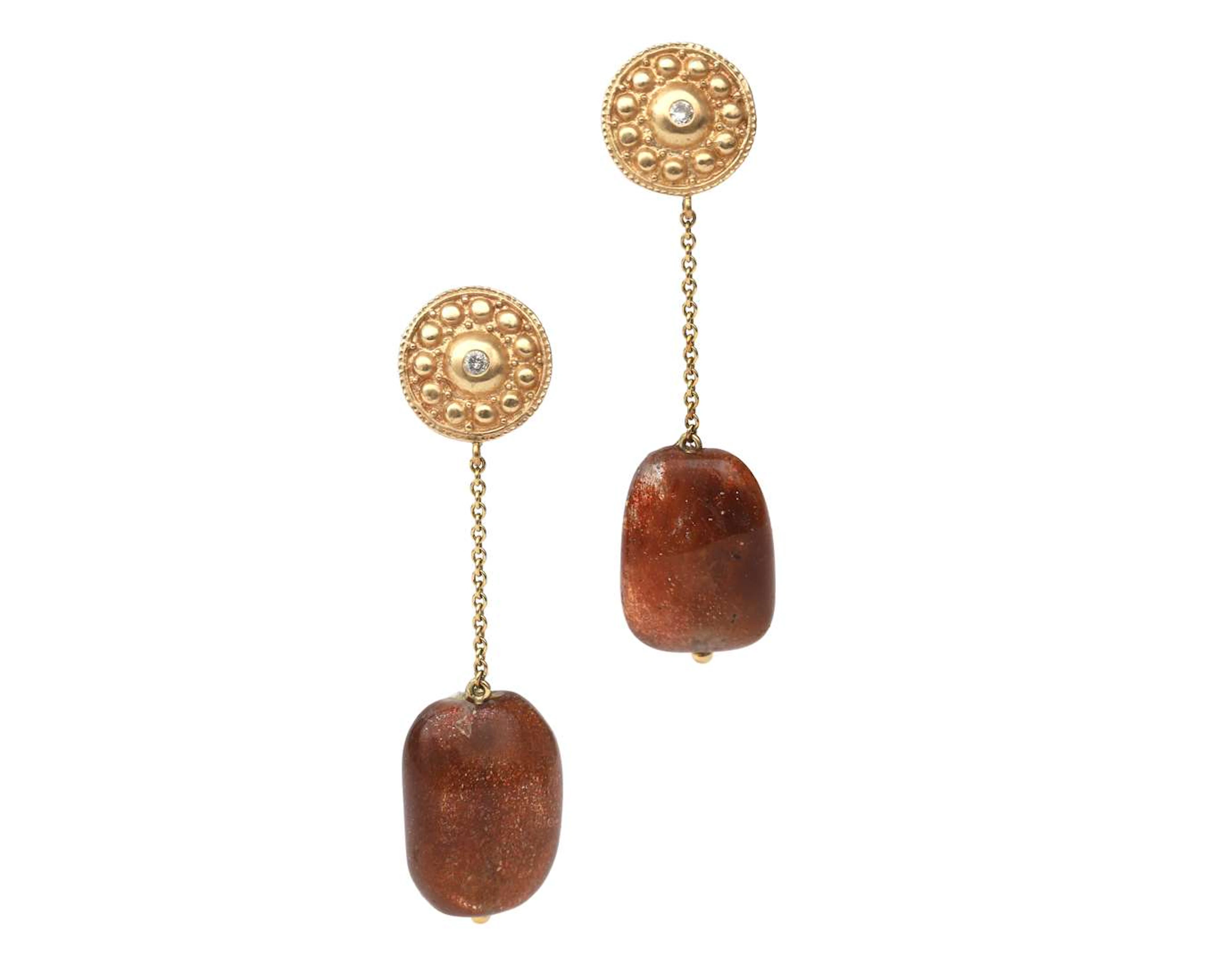 A pair of 14 carat yellow gold earrings with amazonite and diamonds