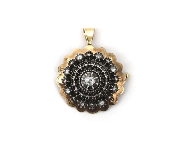 A 14k yellow gold and silver brooch/pendant set with rose-cut diamonds