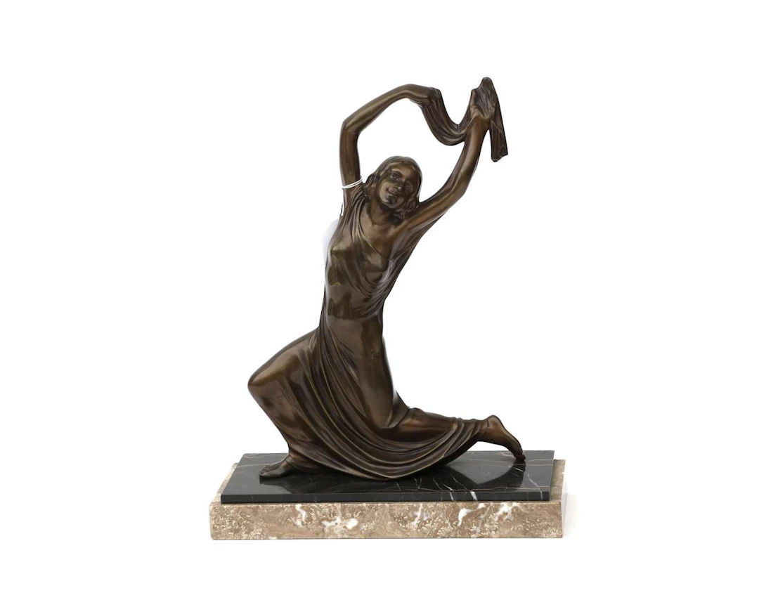 A bronze statue of a dancer, by M. Font