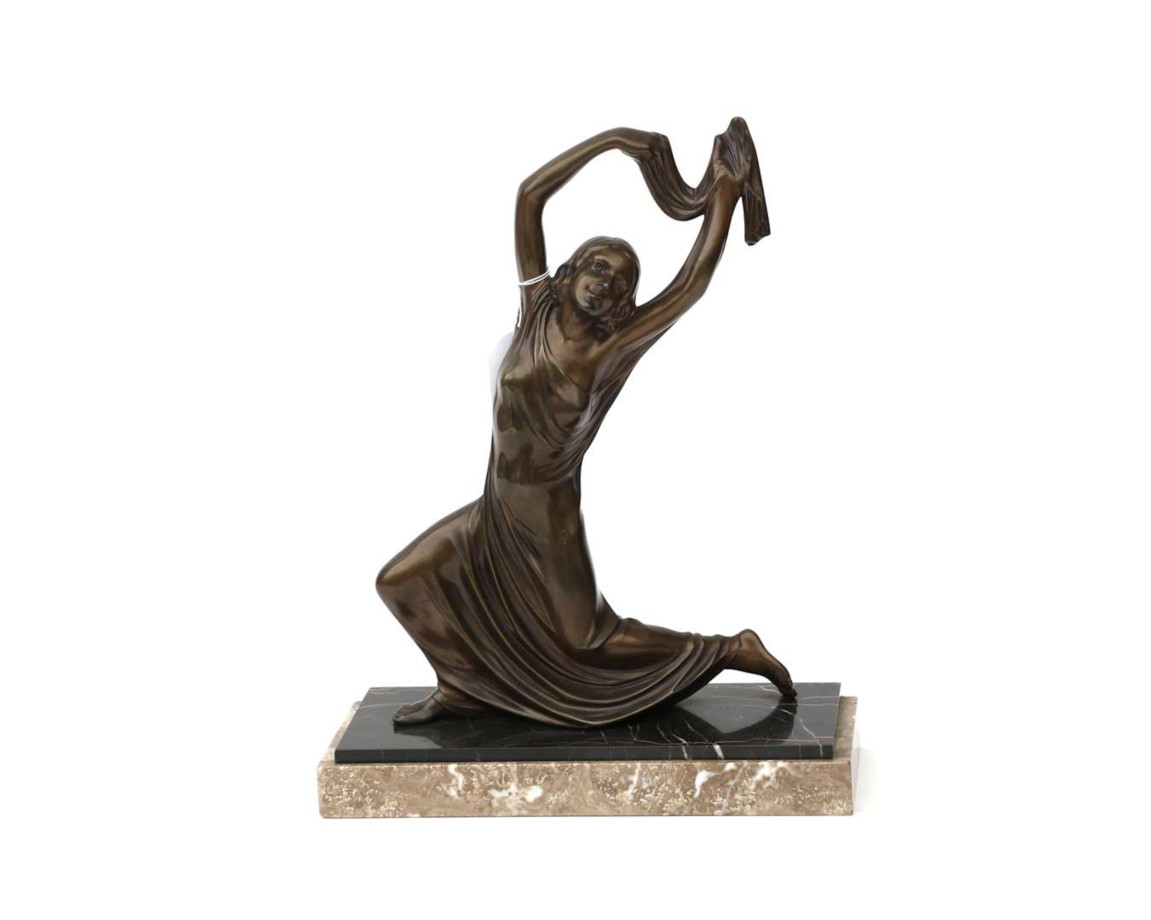 A bronze statue of a dancer, by M. Font