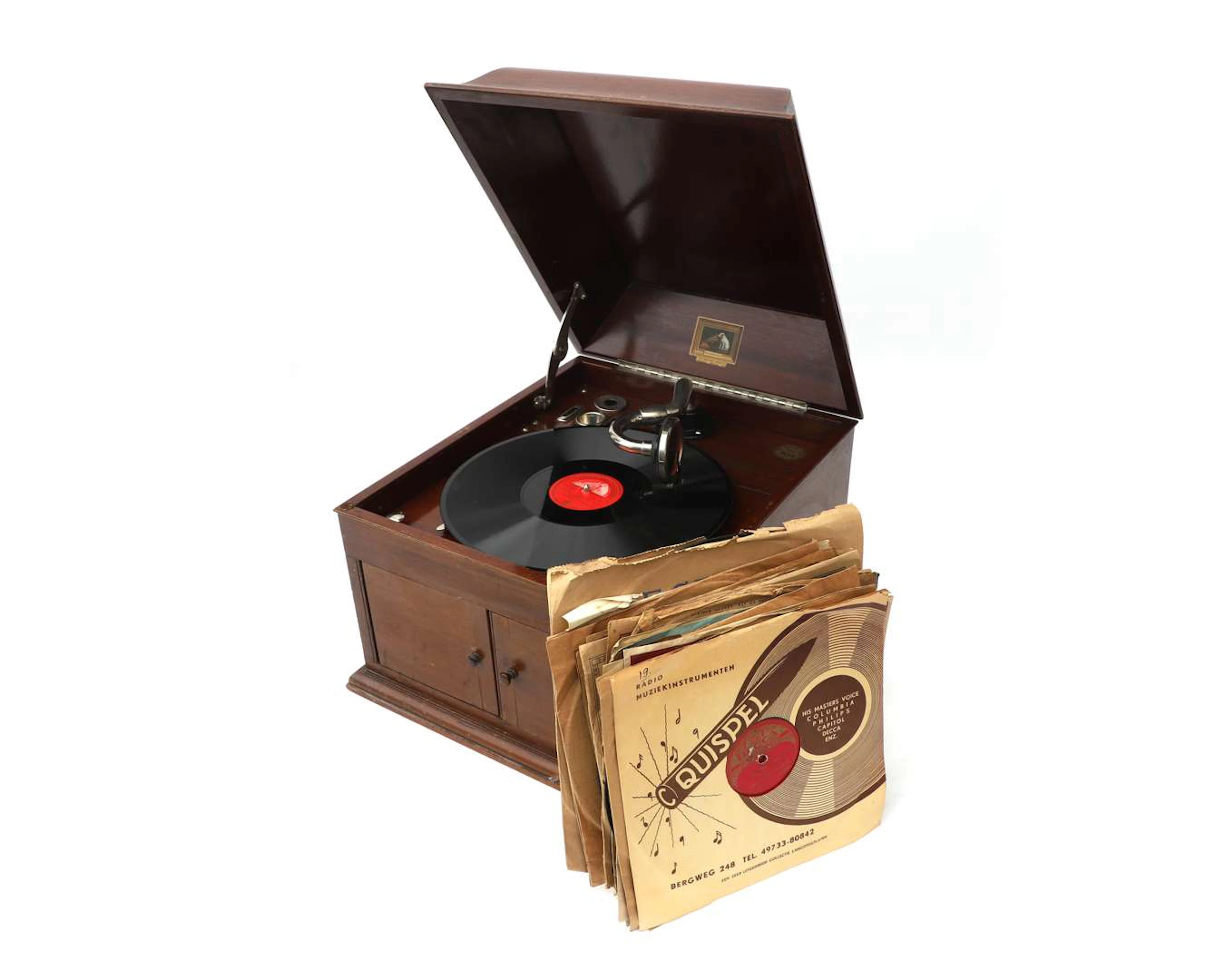 A gramophone in an oak cabinet, ‘His Master’s Voice’ model, England