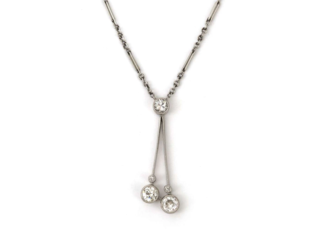 A 14k white gold and platinum Belle Époque ‘négligée’ necklace set