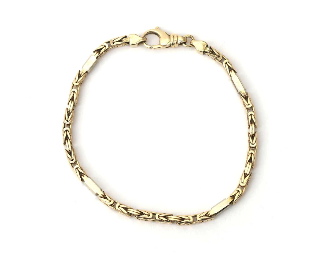 A 14-carat two-tone gold king’s chain bracelet