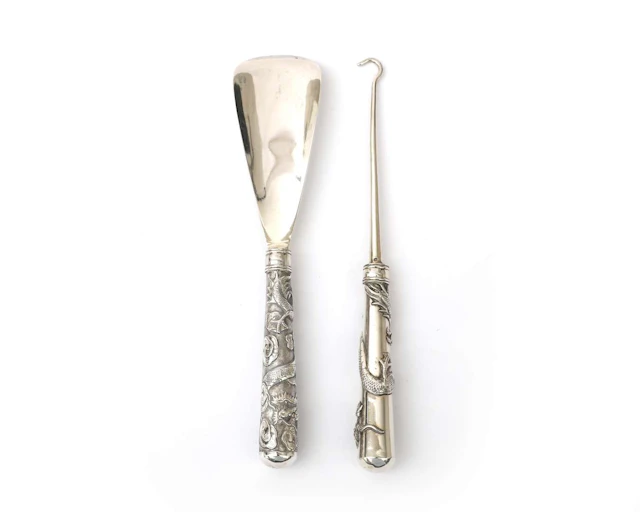 A silver shoehorn and basting hook, China, 20th century