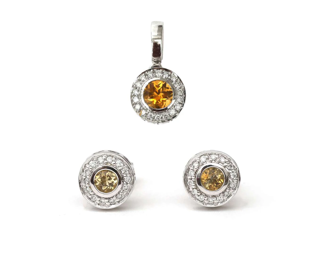 A 14-carat white gold pendant and stud earrings set with citrine and diamonds