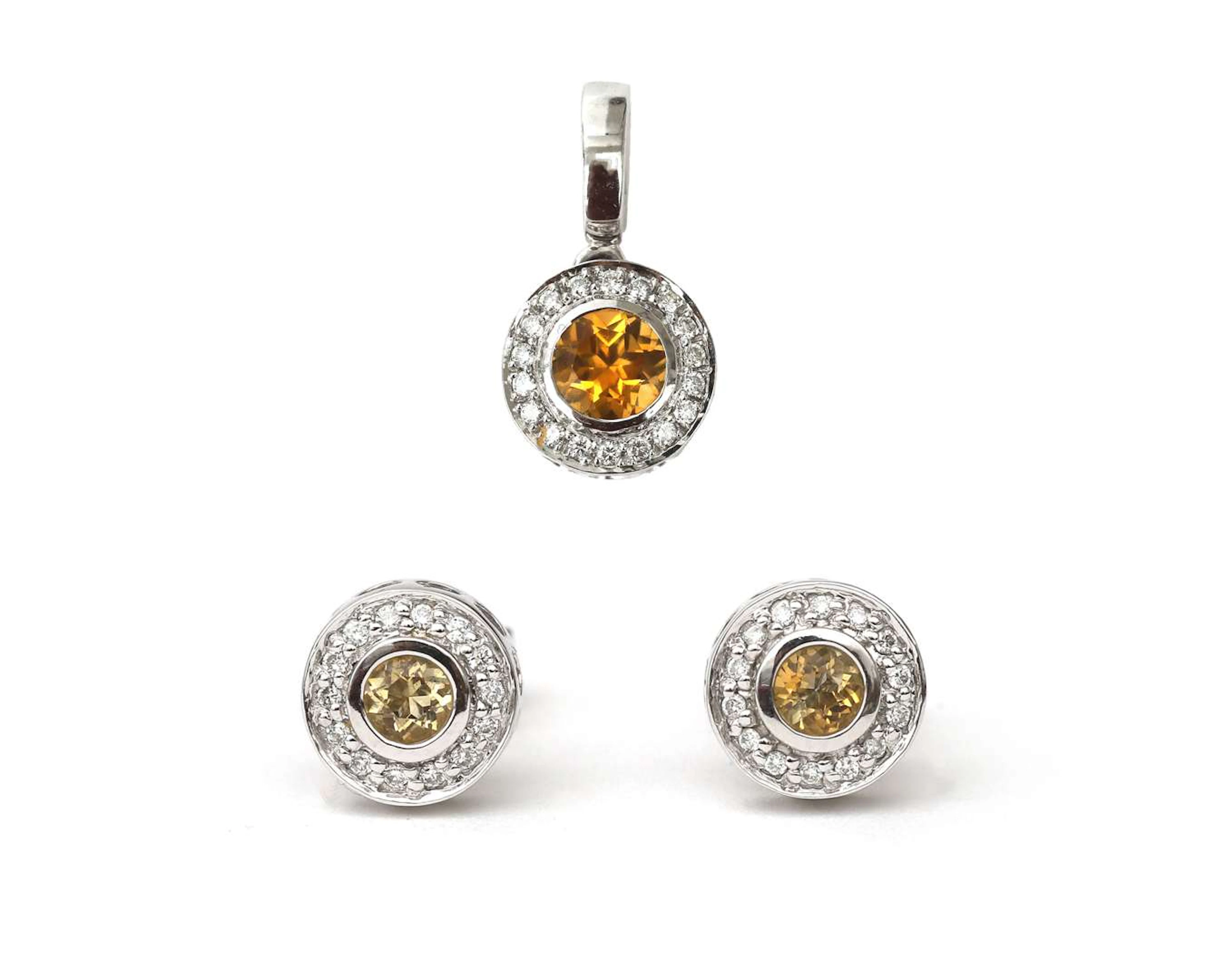 A 14-carat white gold pendant and stud earrings set with citrine and diamonds