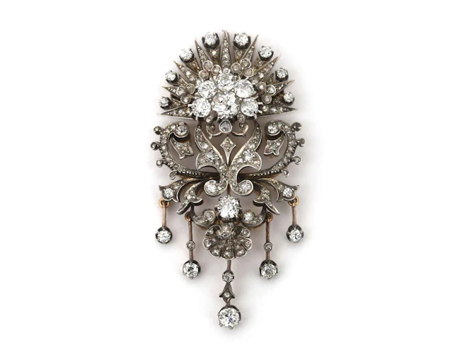 An 18-carat yellow gold devant-de-corsage with silver and diamonds