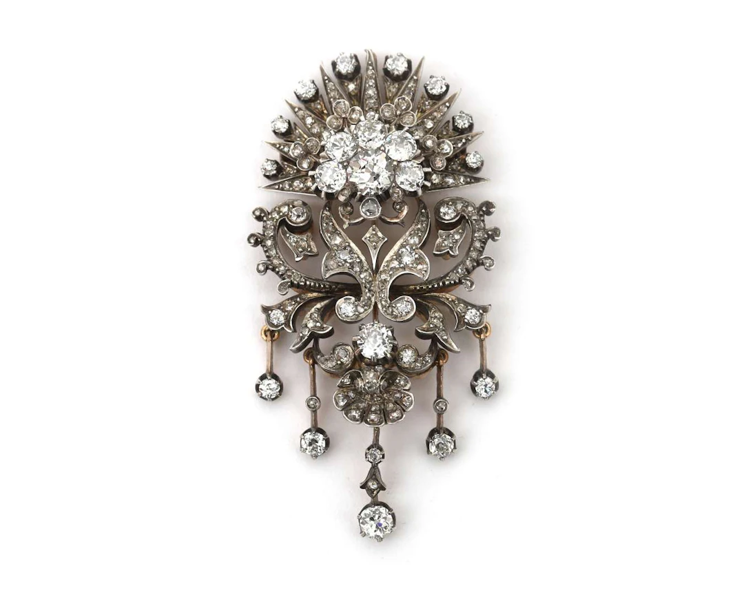 An 18-carat yellow gold devant-de-corsage with silver and diamonds