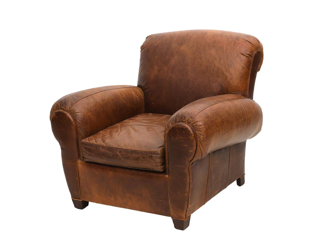 A brown leather club armchair, made by Arthur McMilan (private), 20th century
