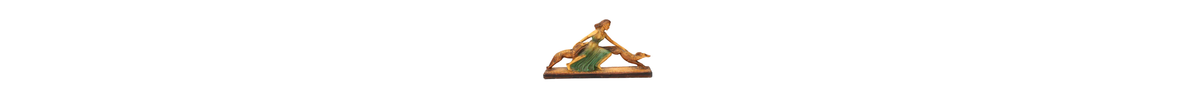 An Art Deco-style sculpture of a woman with greyhounds, 20th century
