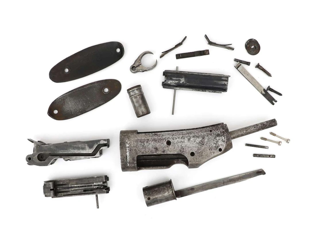 A set of parts for a slide-action rifle, Model 1893, manufactured