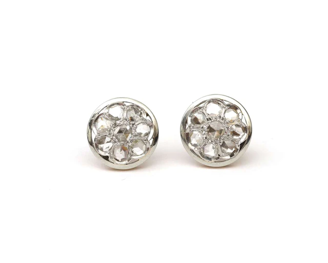 A pair of 14k bicolour gold stud earrings with a rose-cut diamond