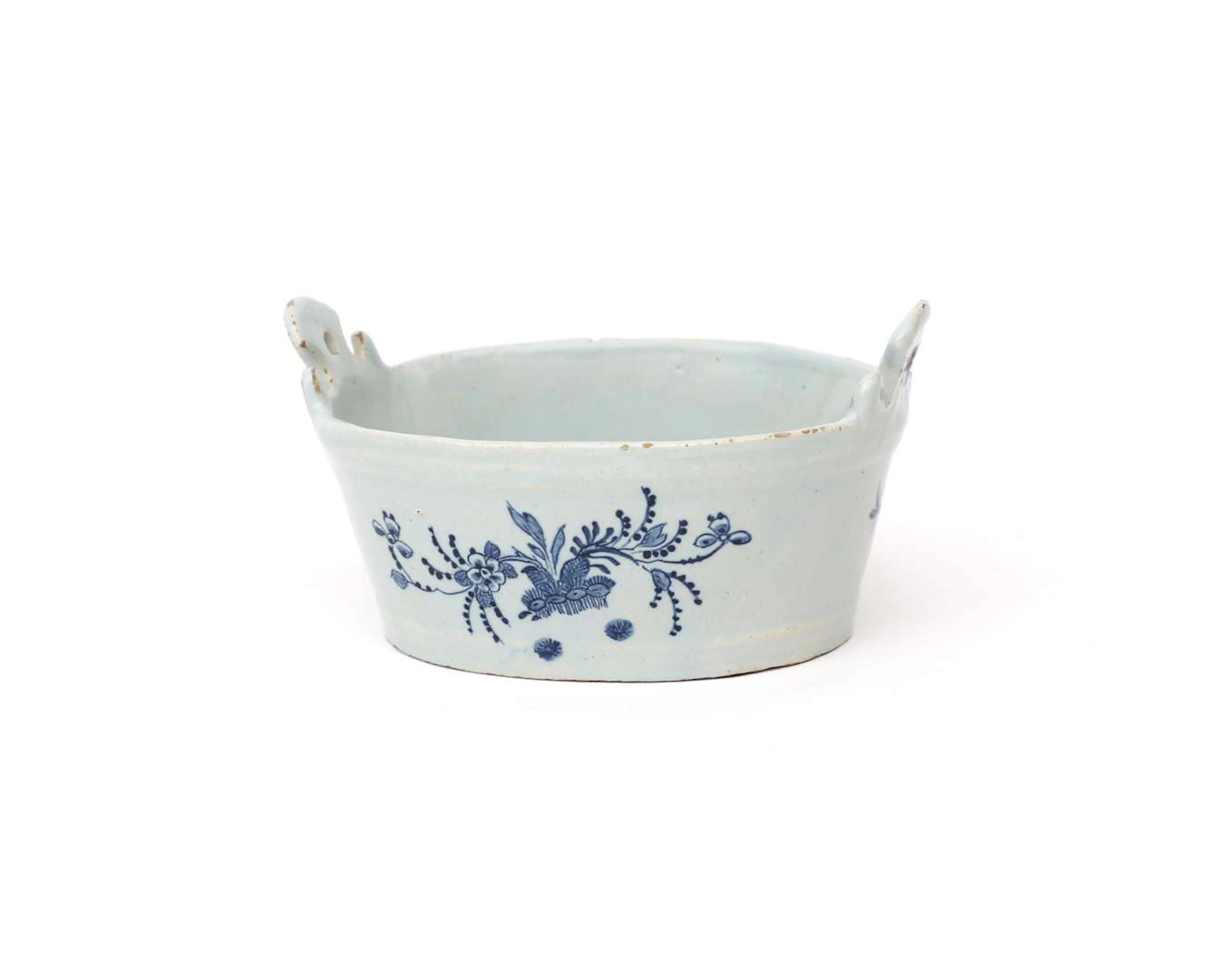 An earthenware butter dish, made by: De Porceleyne Byl, Holland, Delft