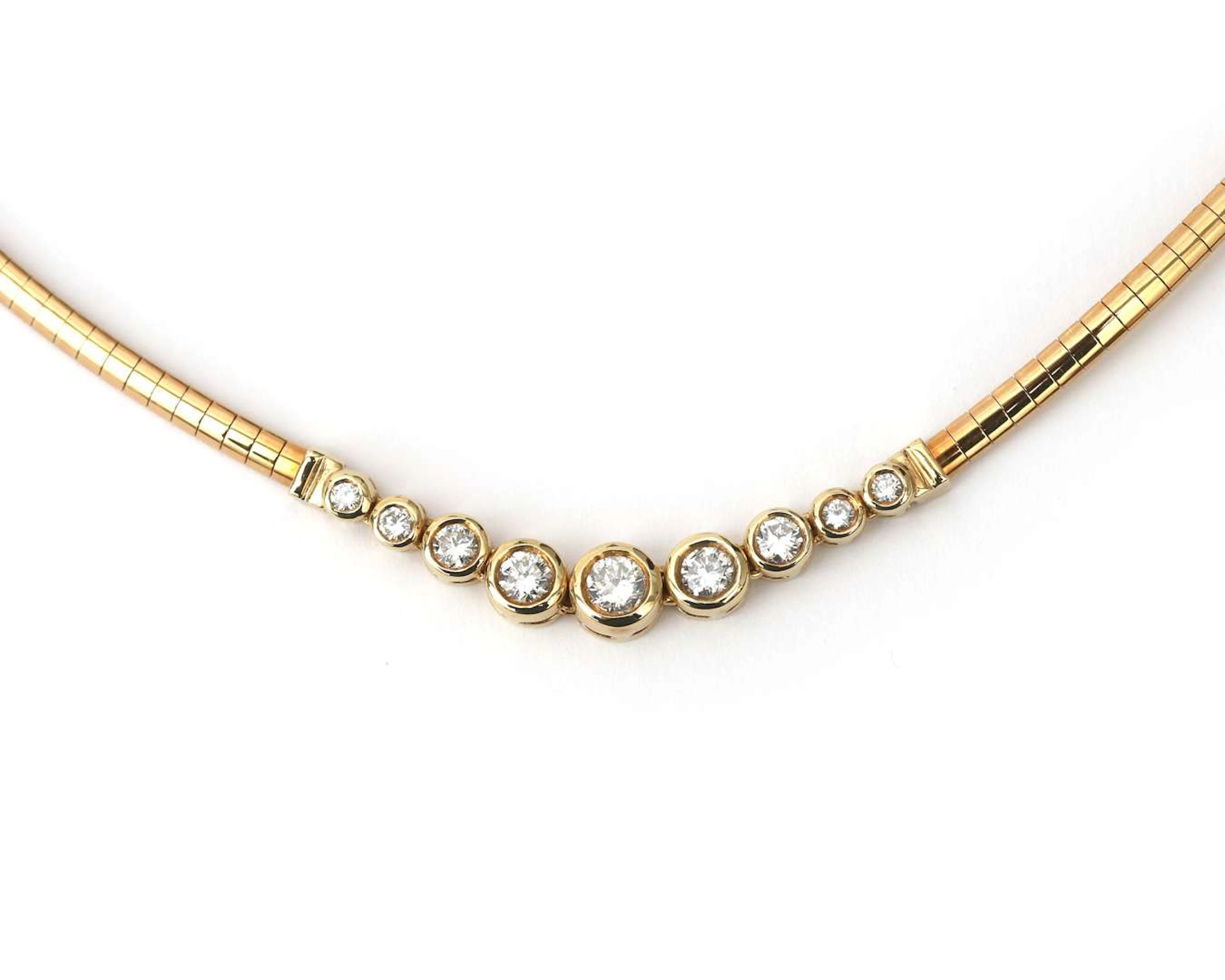 A 14k yellow gold omega-link necklace set with 9 diamonds, totalling