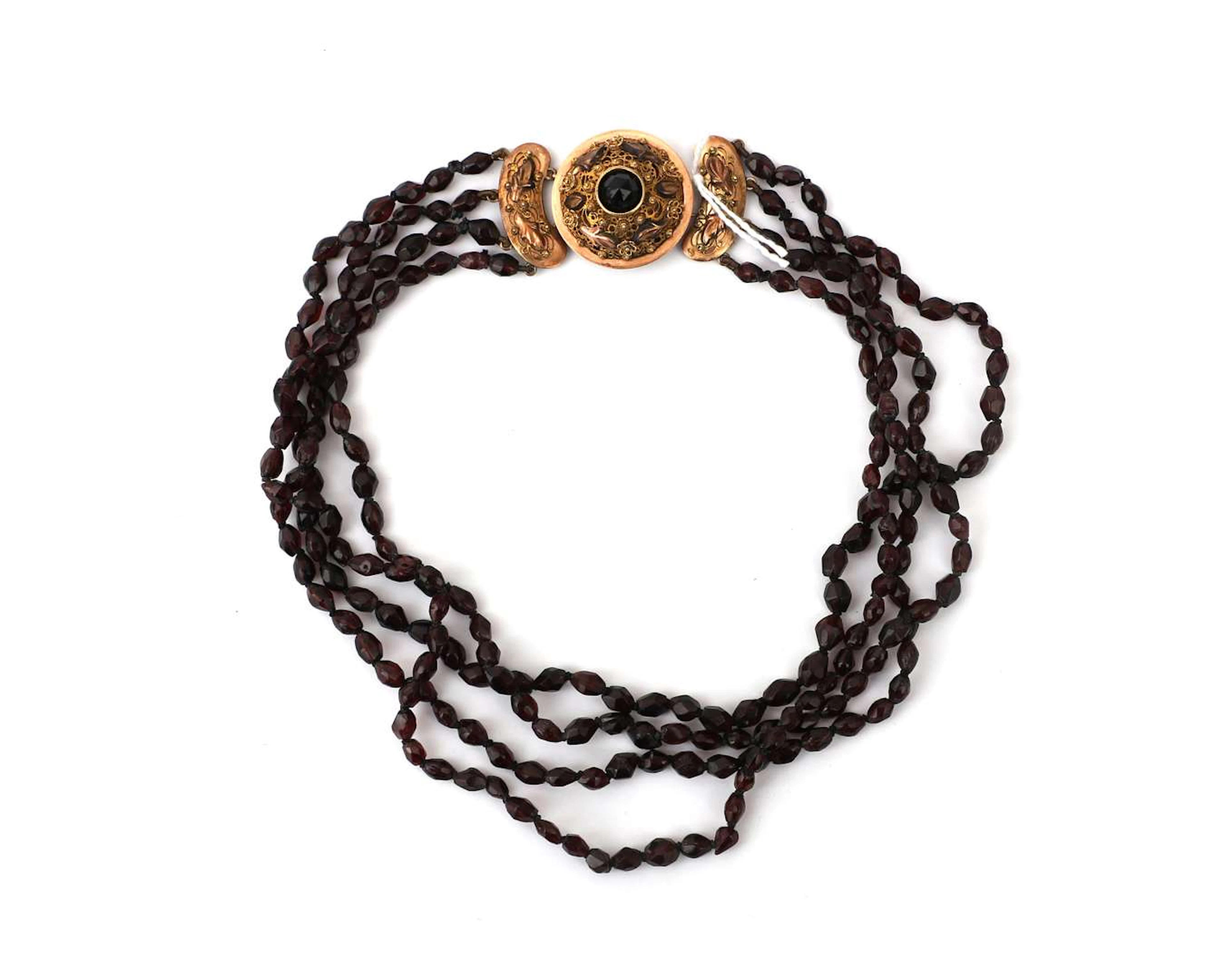A four-strand garnet choker necklace with a 14k yellow gold clasp