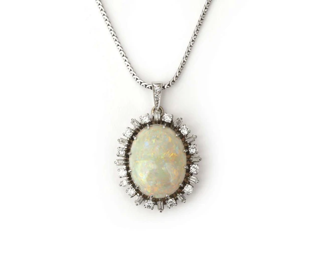 An 18k white gold necklace with a pendant set with diamonds and an opal
