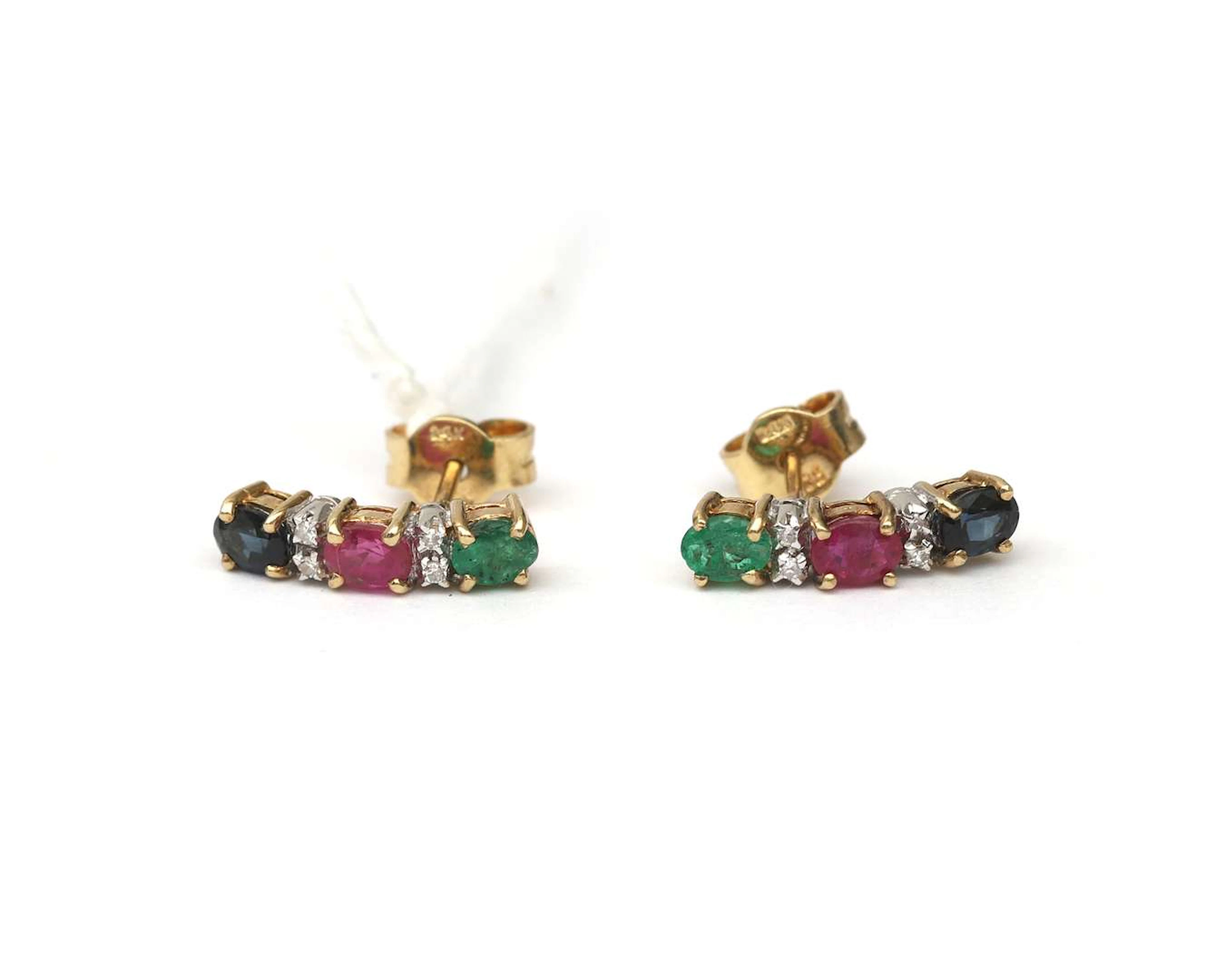 A pair of 14k yellow gold stud earrings set with rubies, sapphires