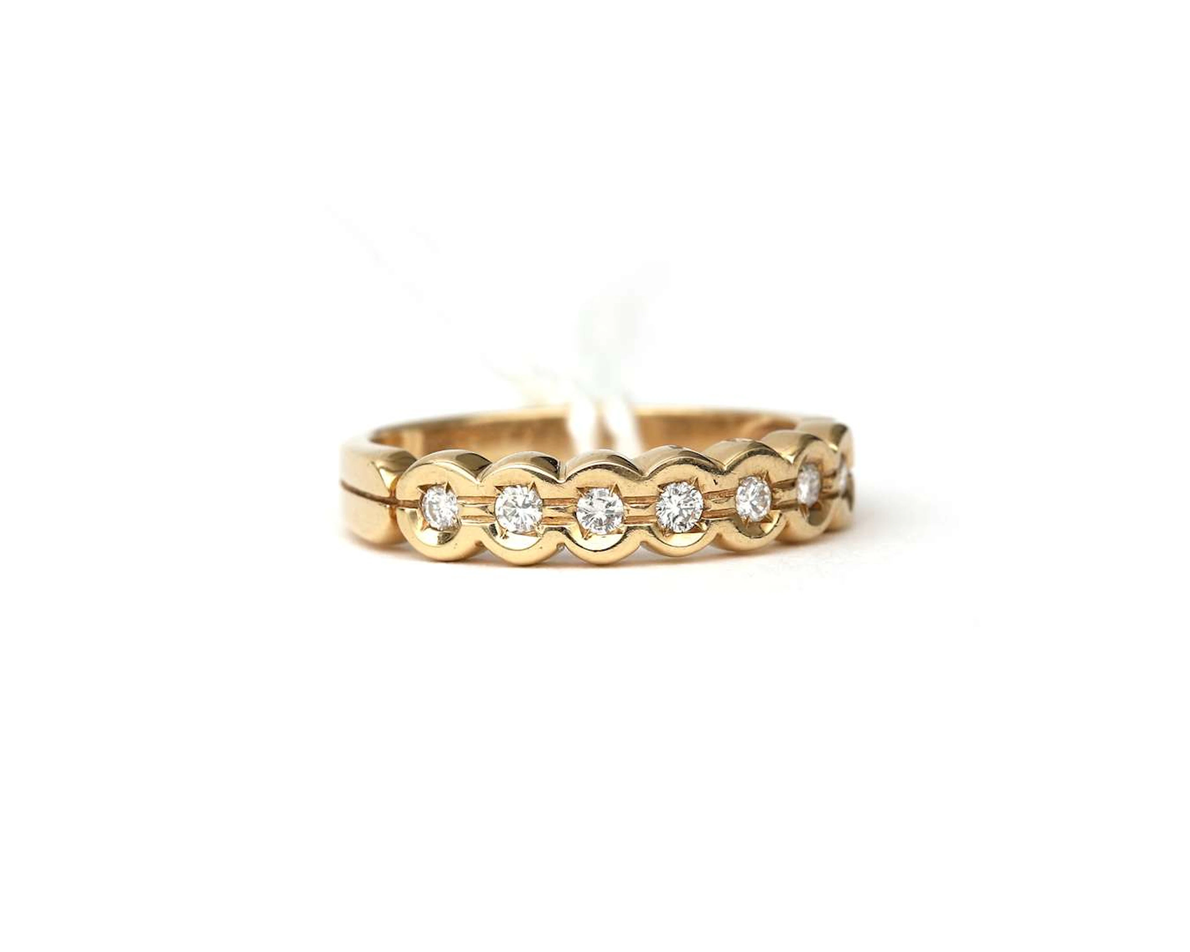 A 14k yellow gold seven-stone ring with diamonds