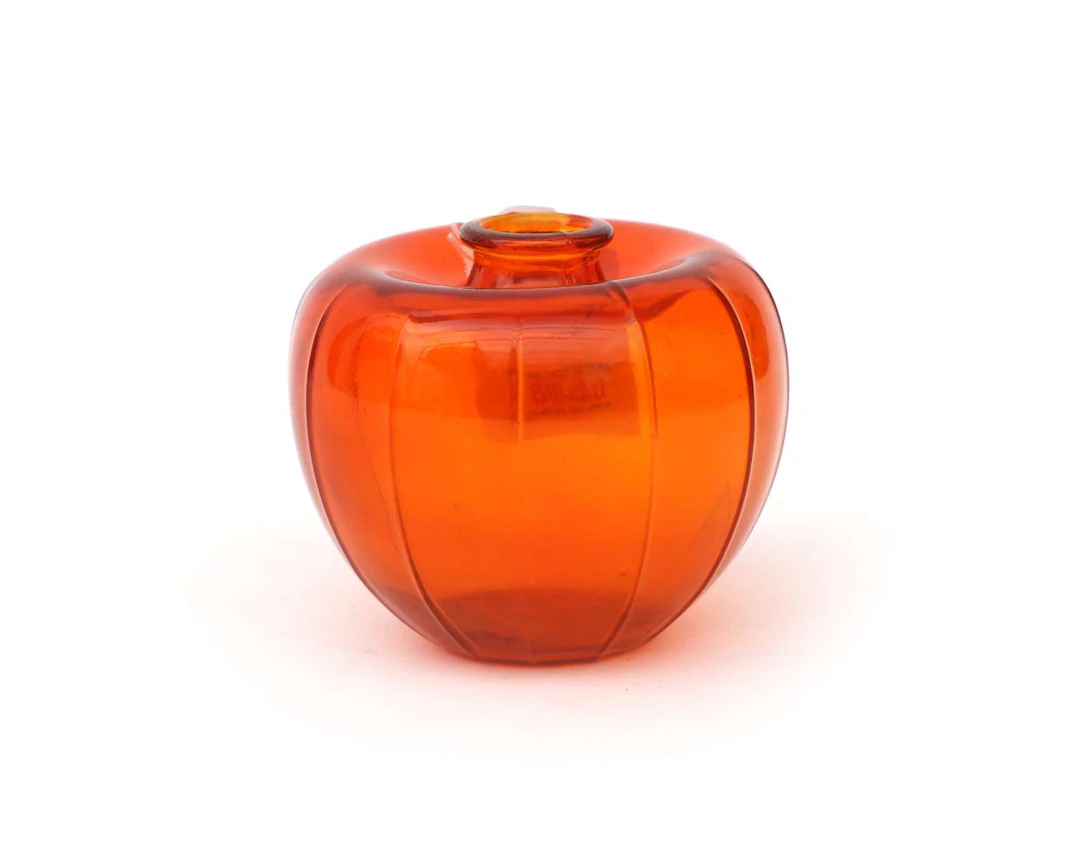 An orange pressed-glass ‘liberation vase’. Designed by A.D. Copier