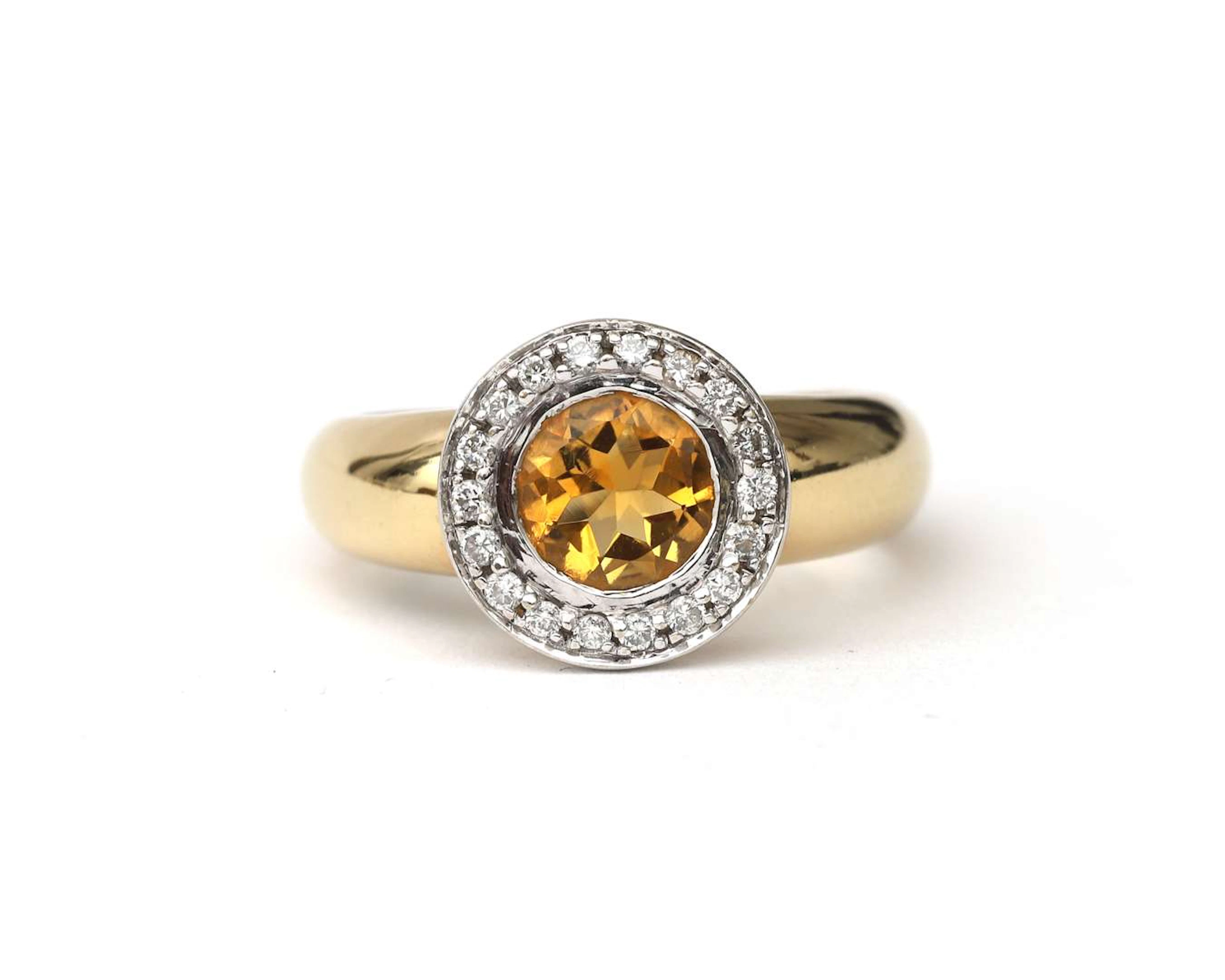 A 14k two-tone ring with citrine and diamond