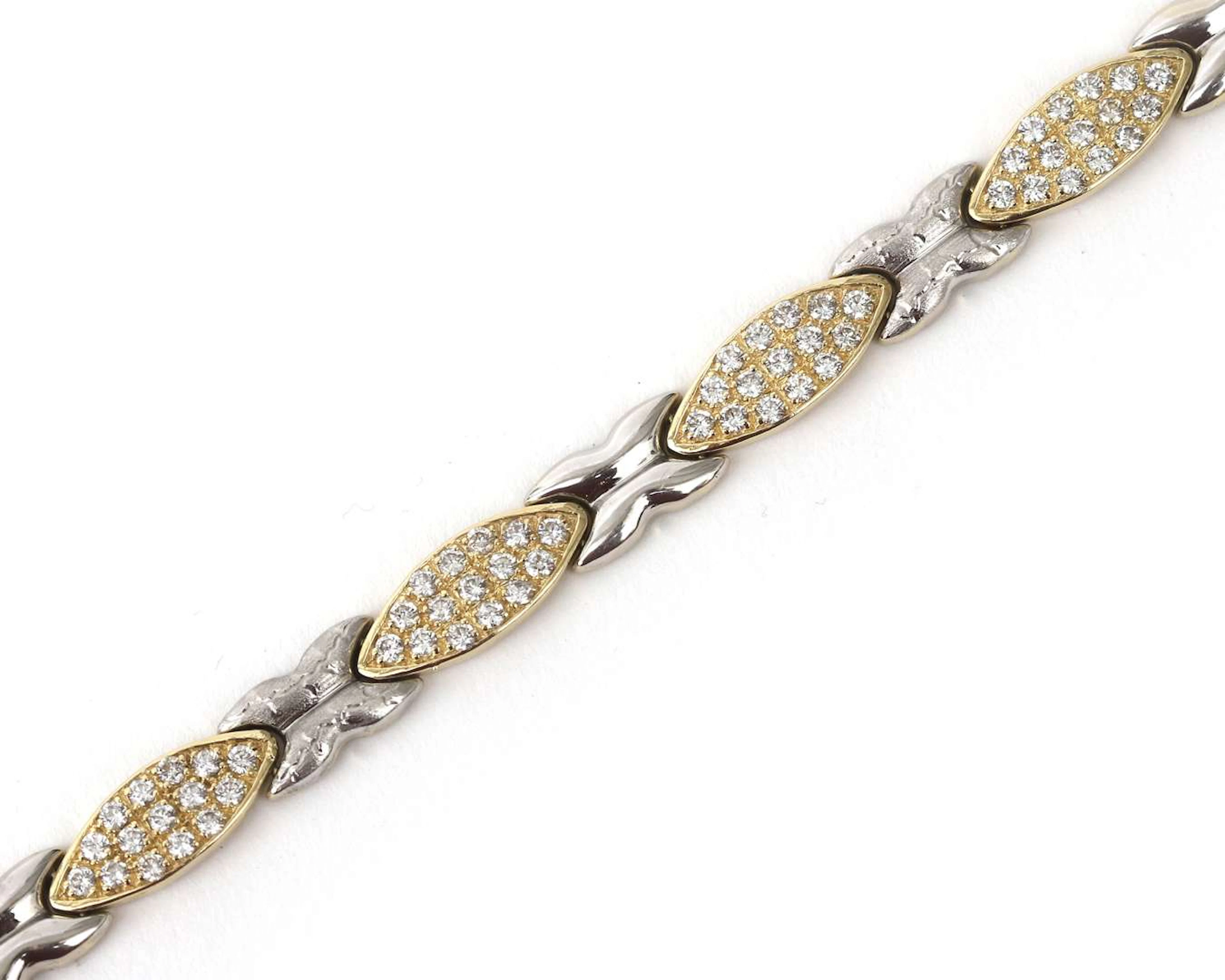 A 14k two-tone gold bracelet with cubic zirconia