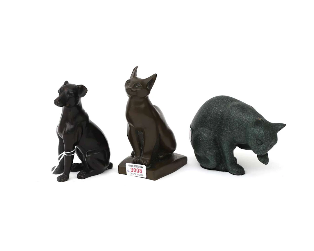 Three different bronze sculptures. Two cats and a dog