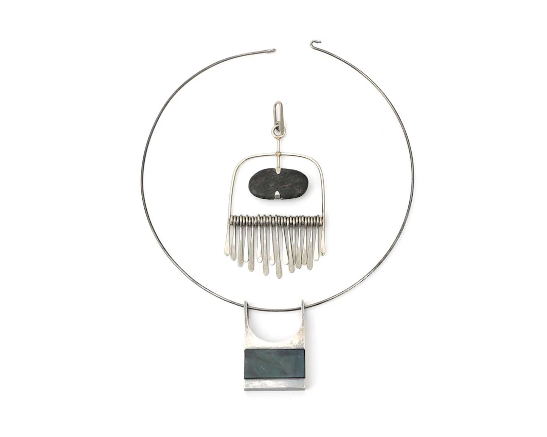 A sterling silver necklace with two pendants