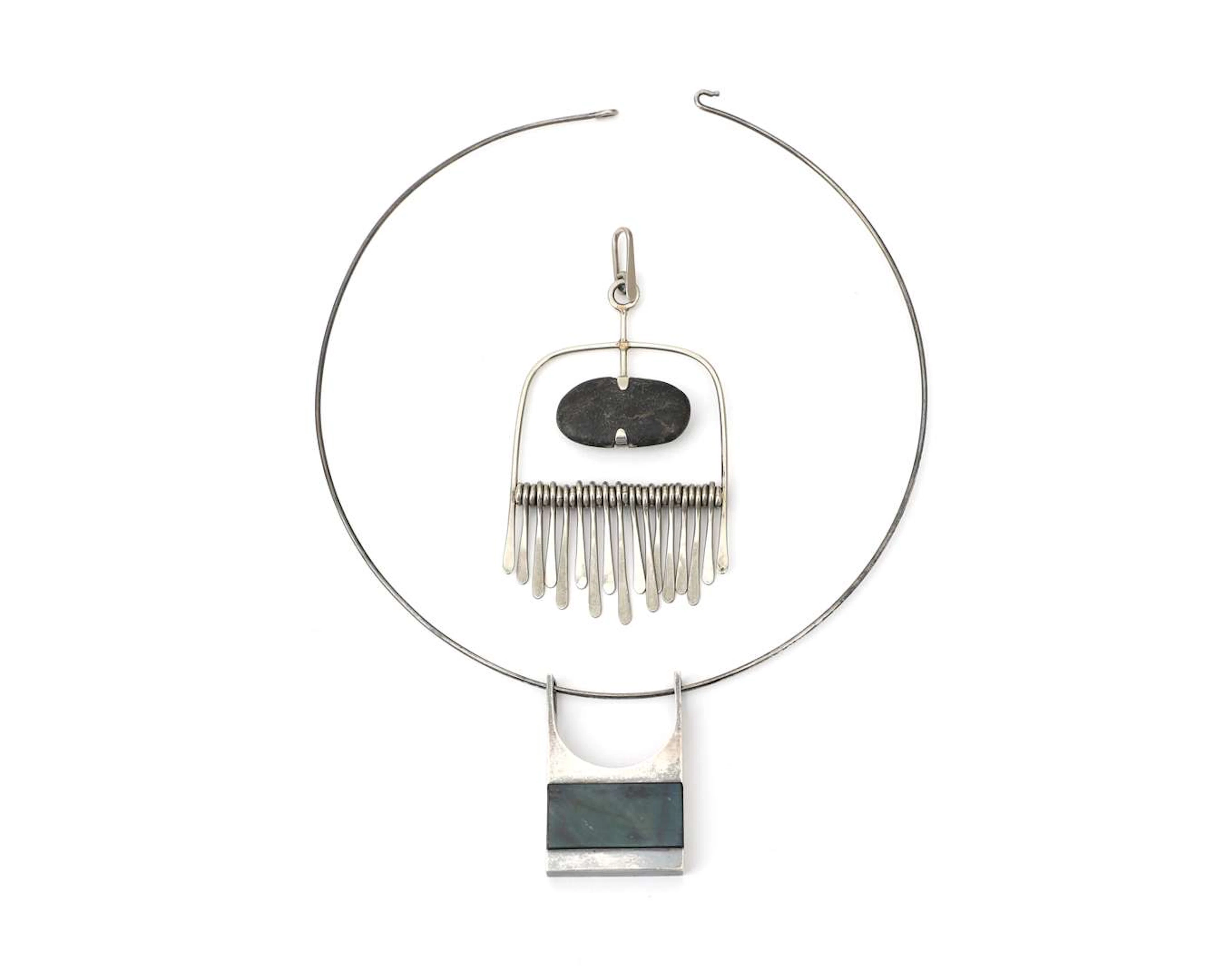 A sterling silver necklace with two pendants