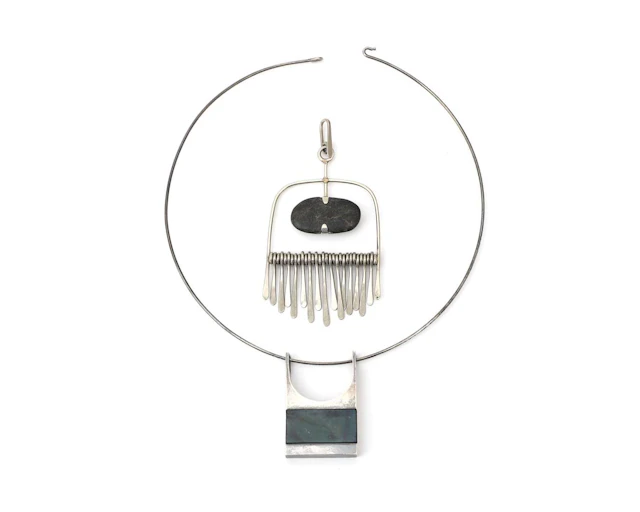 A sterling silver necklace with two pendants