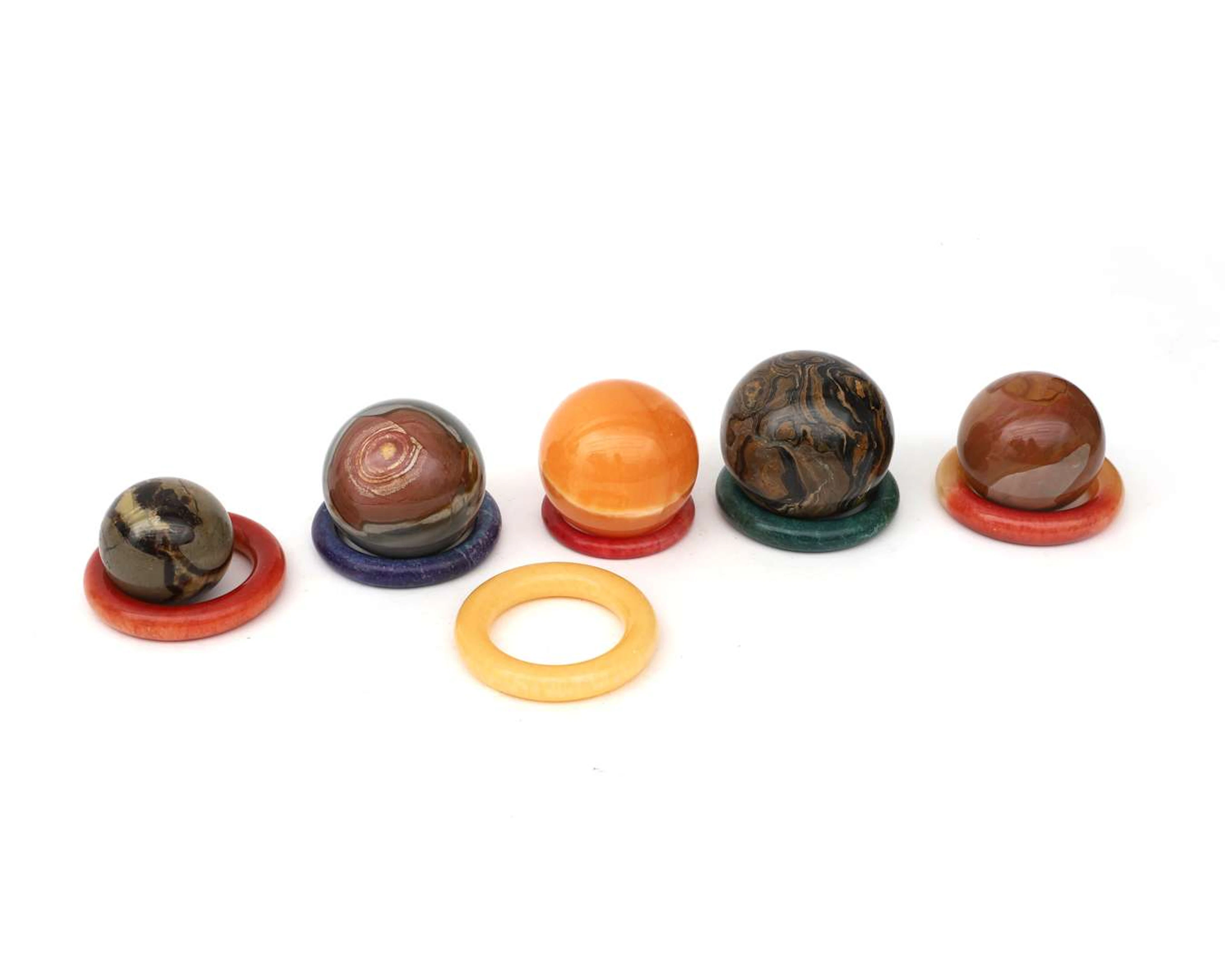 Five natural stone balls with six rings. Asia, 20th century