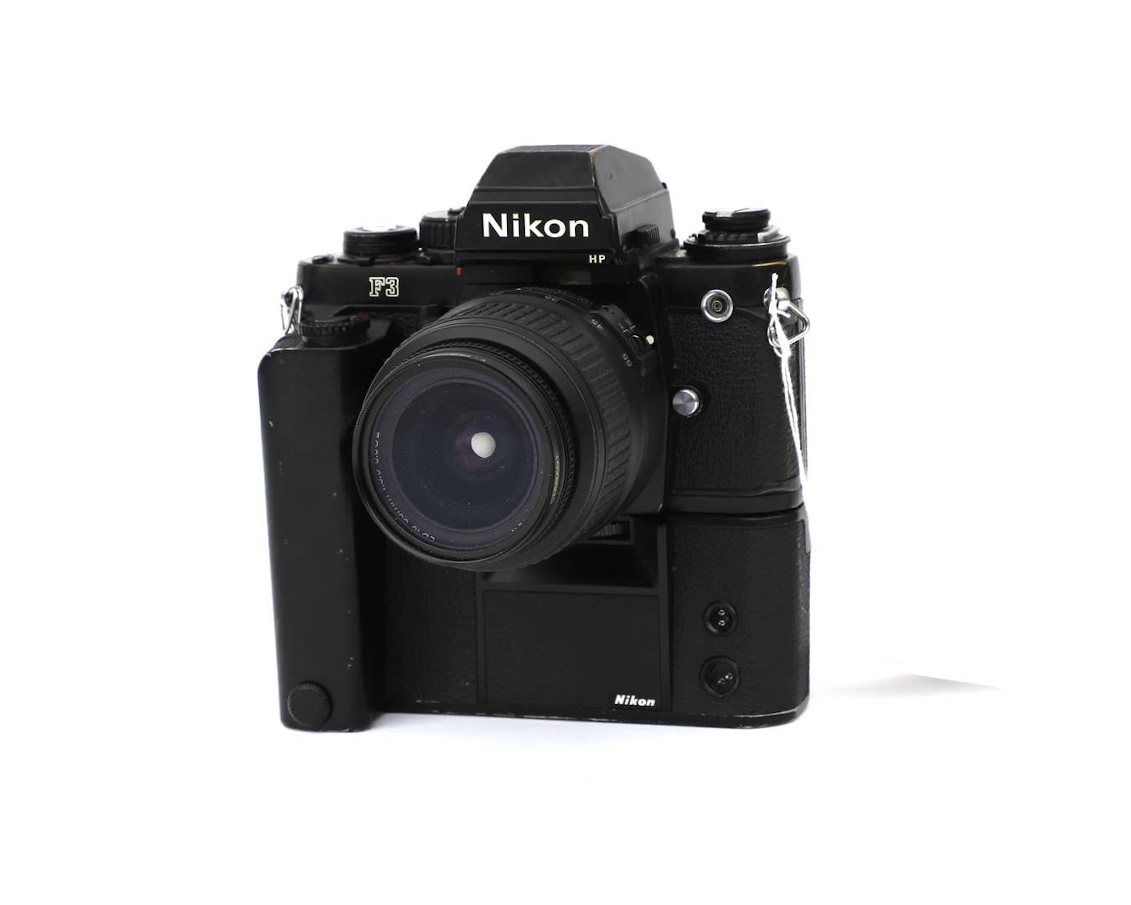 A Nikon F3 camera with a Motor Drive and an AF-S Nikkor lens