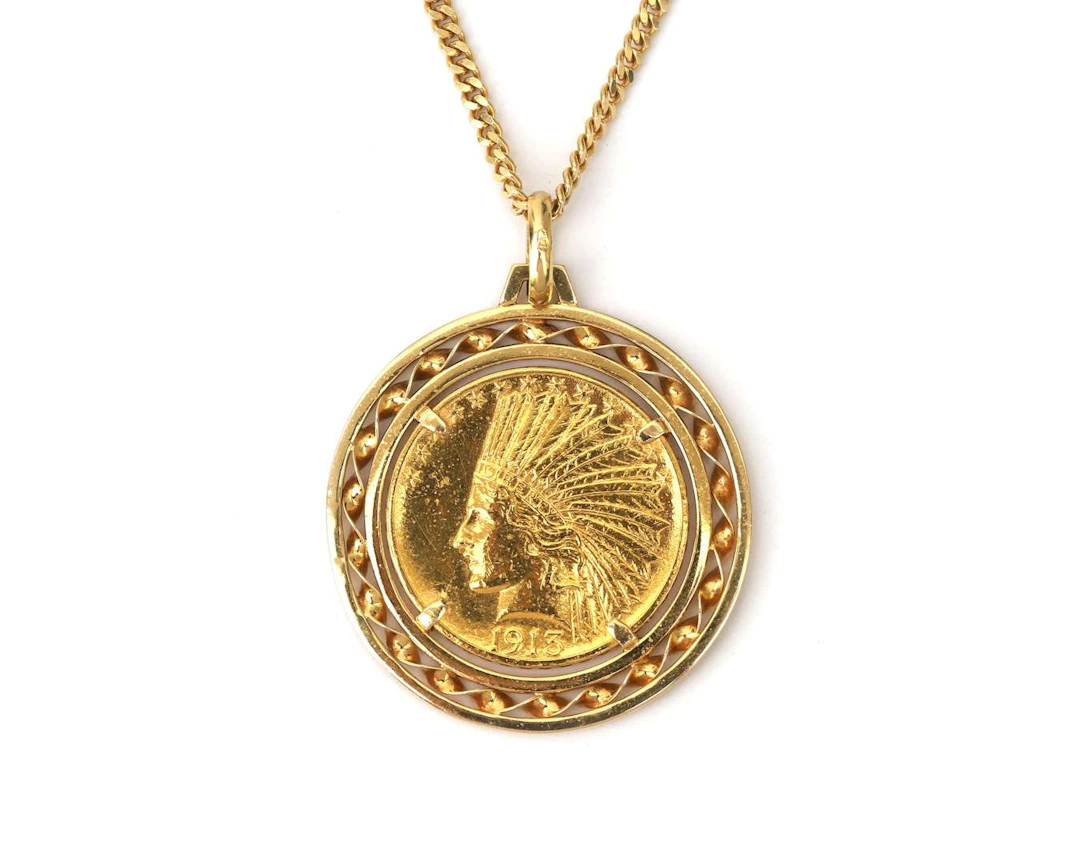 An 18k yellow gold gourmet necklace with a 1913 $10 coin