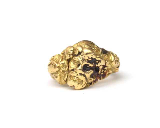An 18k yellow gold Bacchus ring