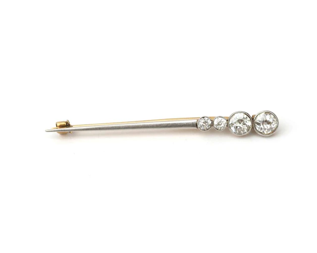 A 14k yellow gold and platinum bar brooch set with a diamond, early